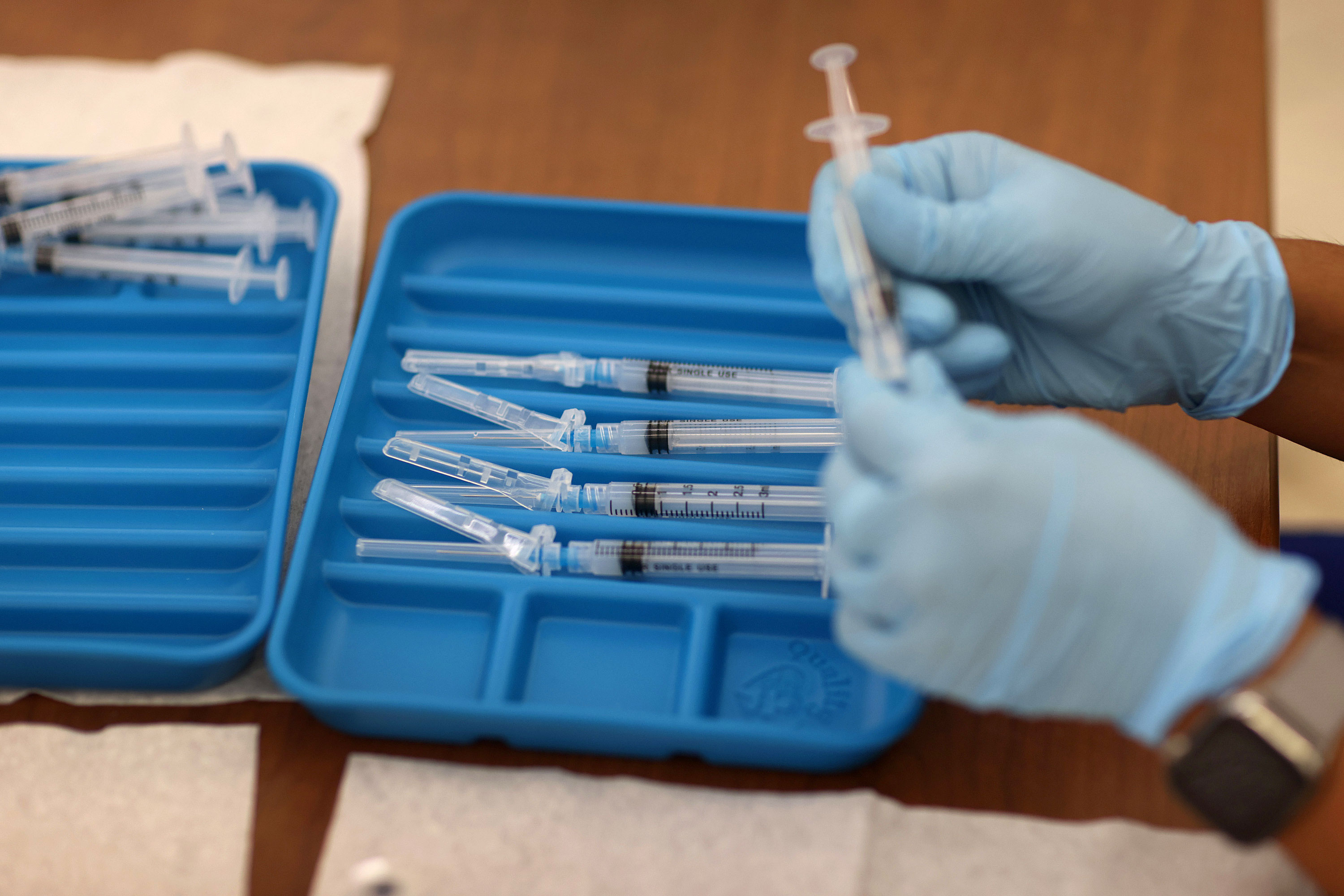 A health care worker prepares Moderna Covid-19 vaccines in Immokalee, Florida, on May 20, 2021. 