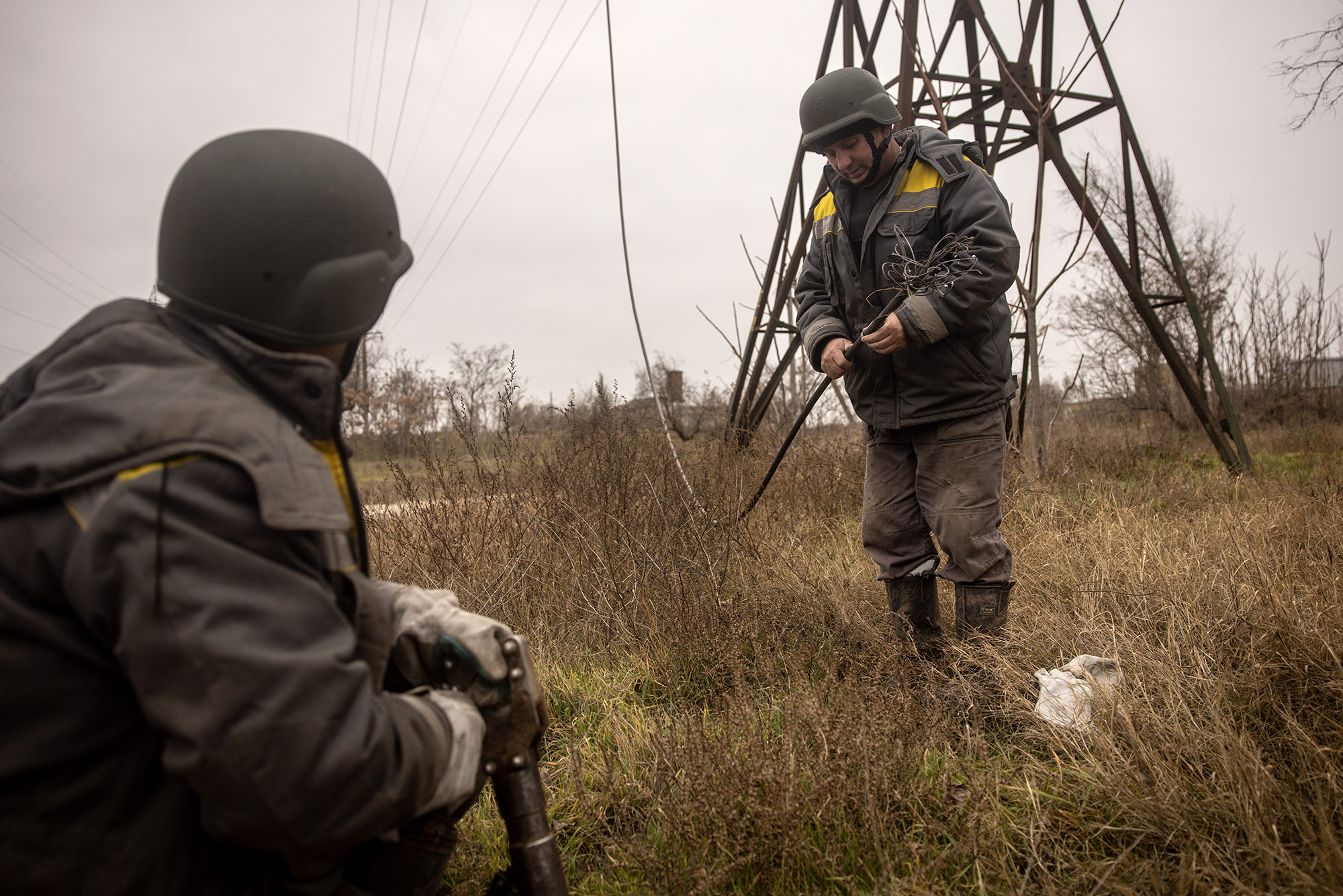 Electrical workers fix a power line in Kherson, Ukraine, on December 1.