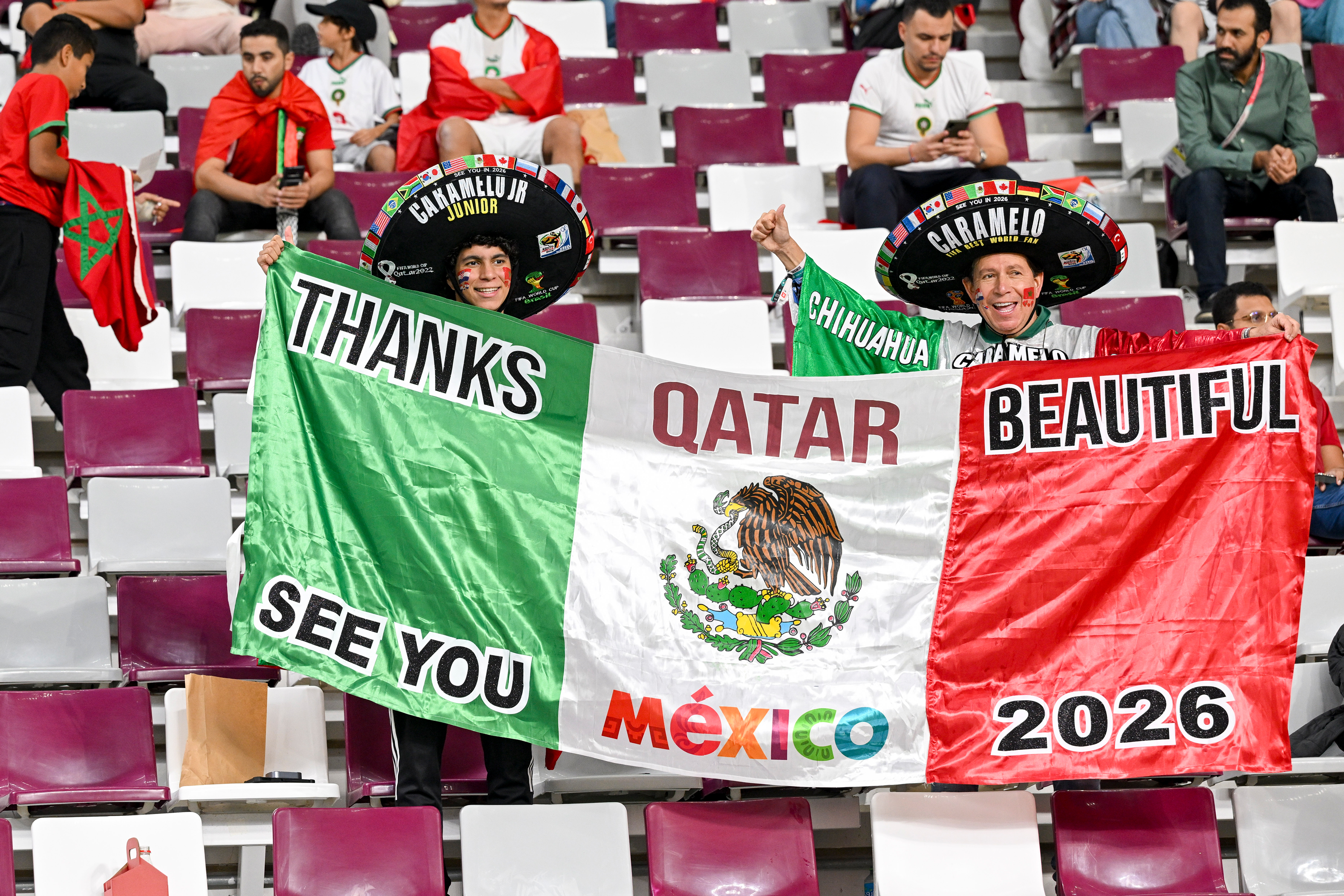 Fans hold flags and banners ahead of the third-place match between Croatia and Morocco at the Khalifa International Stadium in Doha, Qatar, Dec. 17.