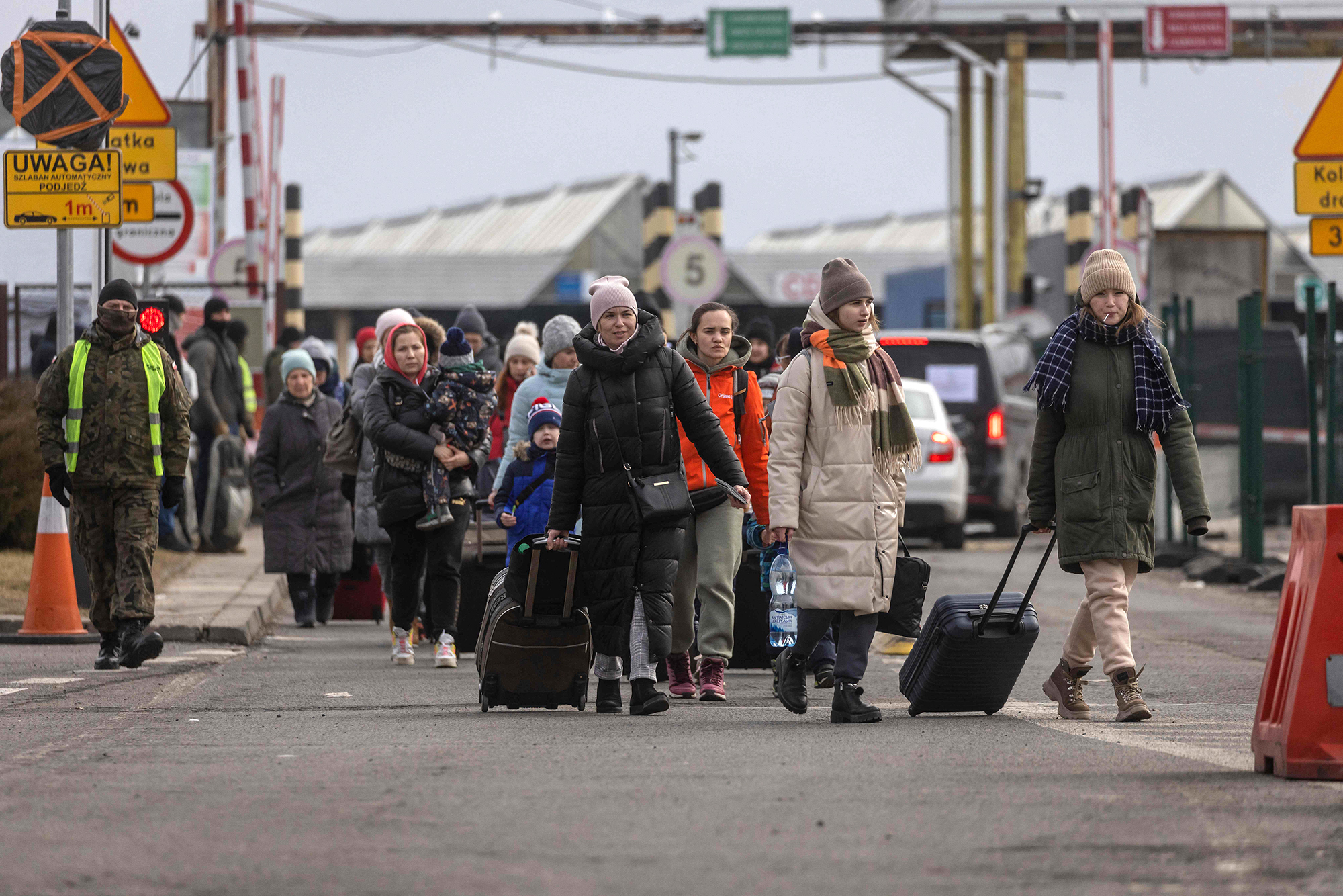 Refugees from Ukraine are pictured after crossing the Ukrainian-Polish border in Korczowa on March 2.