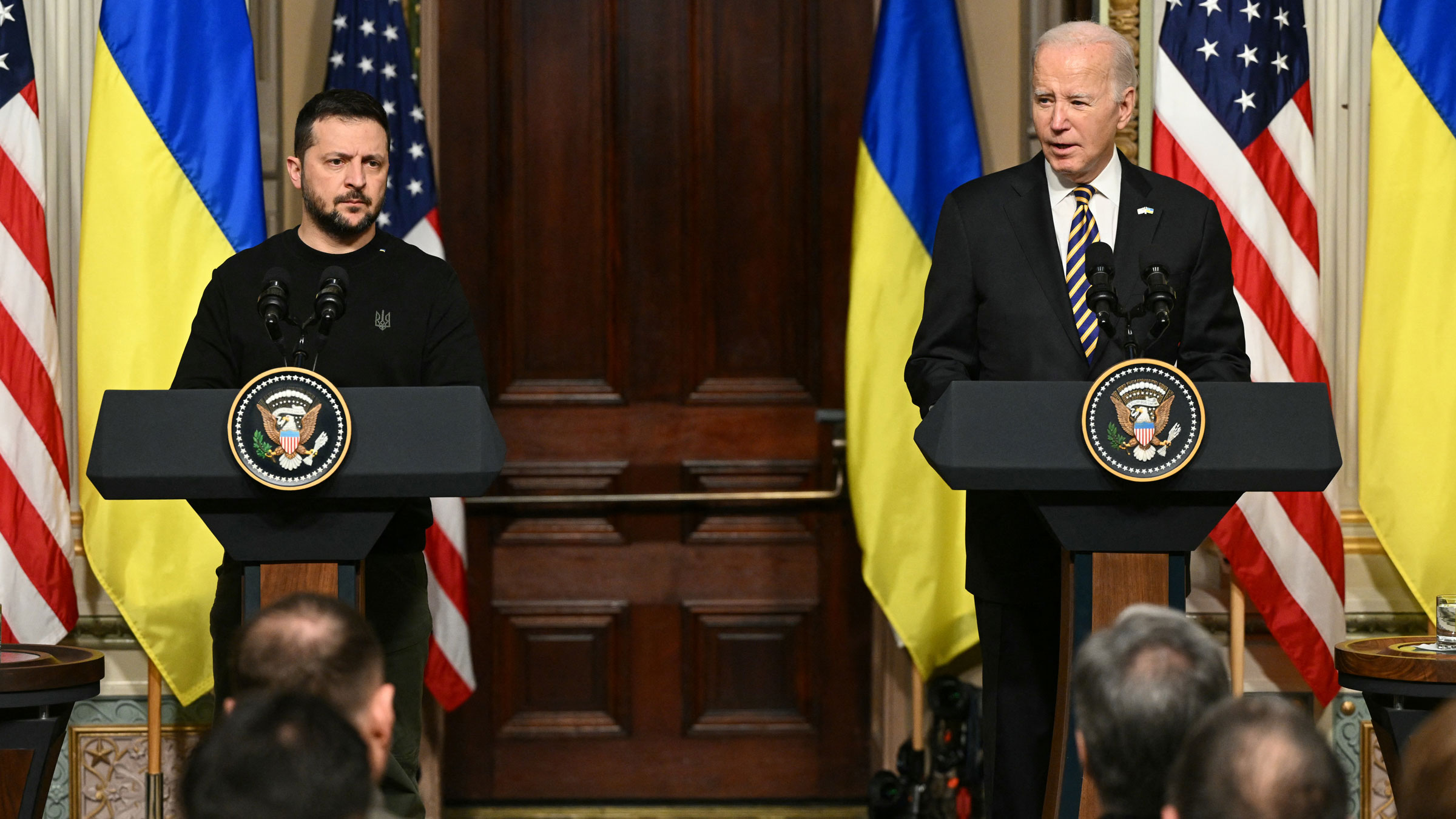 US President Joe Biden, right, and Ukrainian President Volodymyr Zelensky hold a joint news conference at the White House on Tuesday.