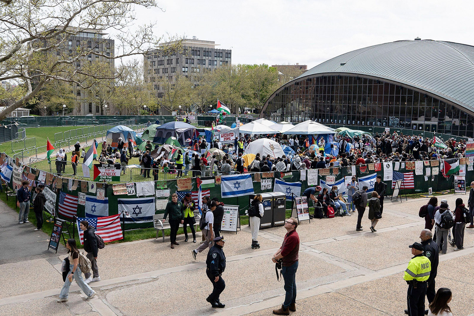 A general view of the MIT pro-Palestine emcampmenbt with metal barricades surrounding it as seen on Friday, May 3.