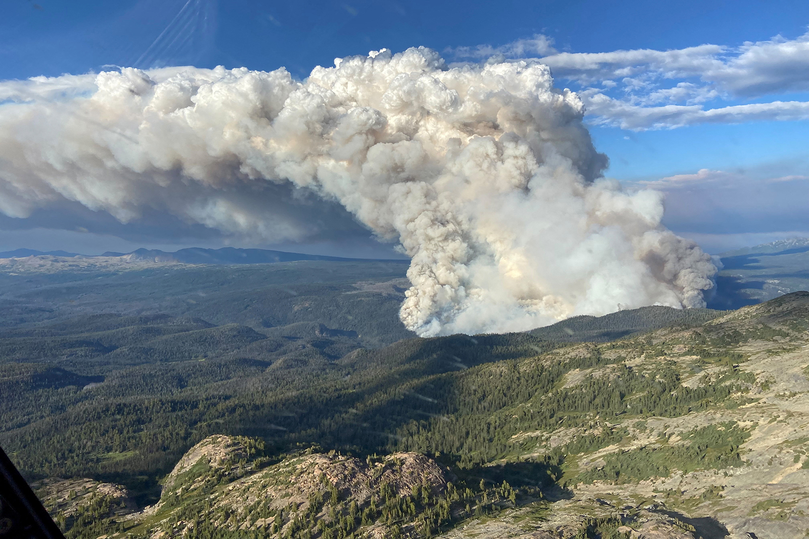 Smoke rises from the Young Creek wildfire in Tweedsmuir Provincial Park, Canada, on  July 16.