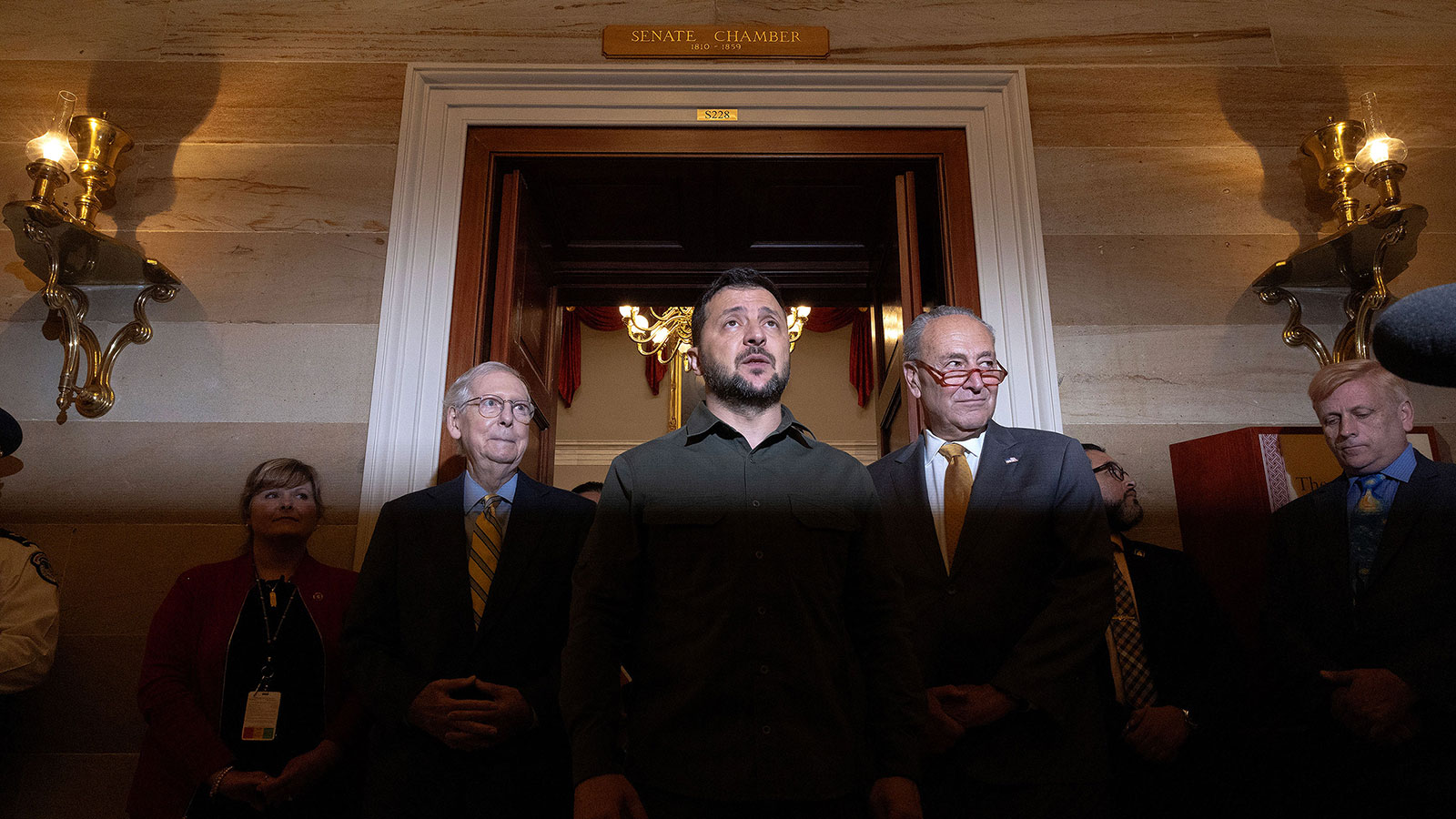 Ukrainian President Volodymyr Zelensky, flanked by Senate leaders Chuck Schumer, right, and Mitch McConnell, speaks to reporters after meeting with senators at the US Capitol in Washington, DC, on September 21, 2023.
