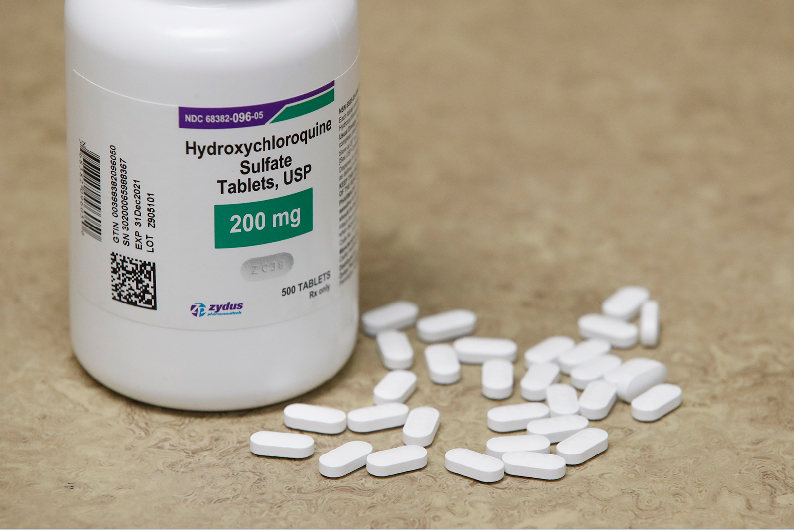 A bottle of hydroxychloroquine and pills sit on a counter at Rock Canyon Pharmacy in Provo, Utah, on May 20.