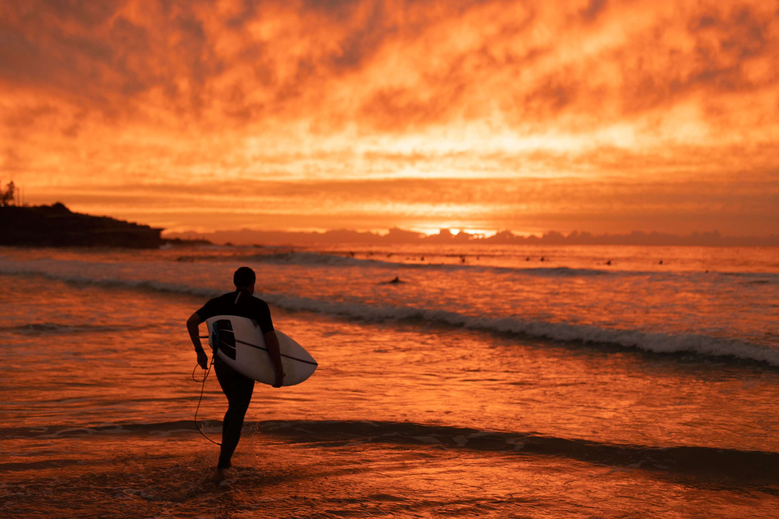 A surfer makes his way out at Maroubra beach on April 20, 2020 in Sydney, Australia. Coogee, Maroubra and Clovelly beaches in Randwick City reopened today for exercise only. 
