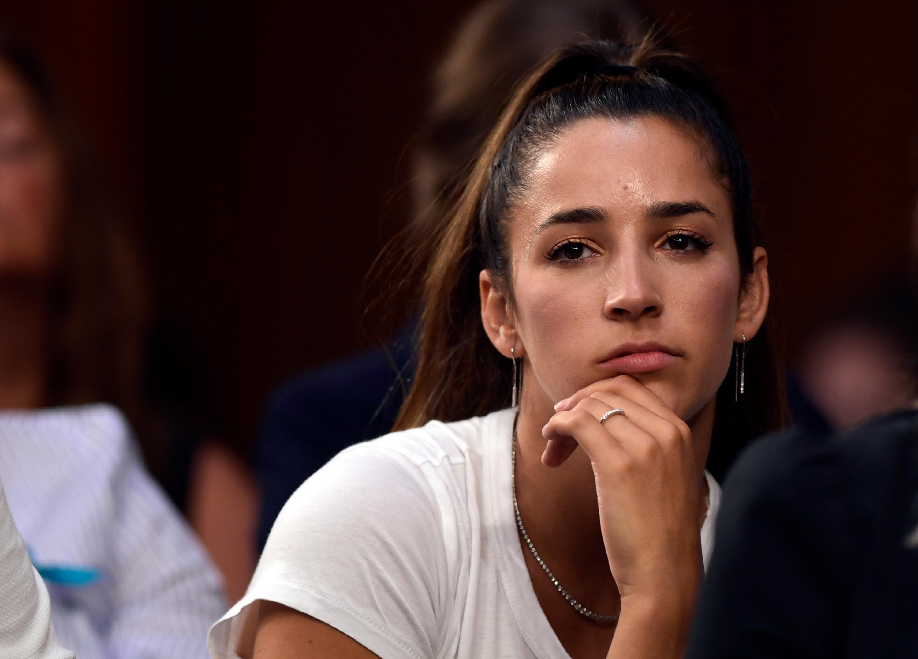 Olympic gold medalist Aly Raisman listens to testimony during a Senate Commerce subcommittee hearing in Washington, DC, July 2018.