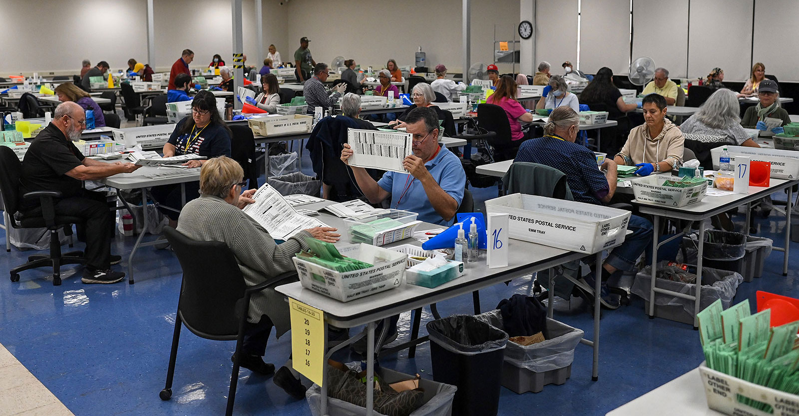 Election workers process ballots at the Maricopa County Tabulation and Election Center on November 10 in Phoenix. 