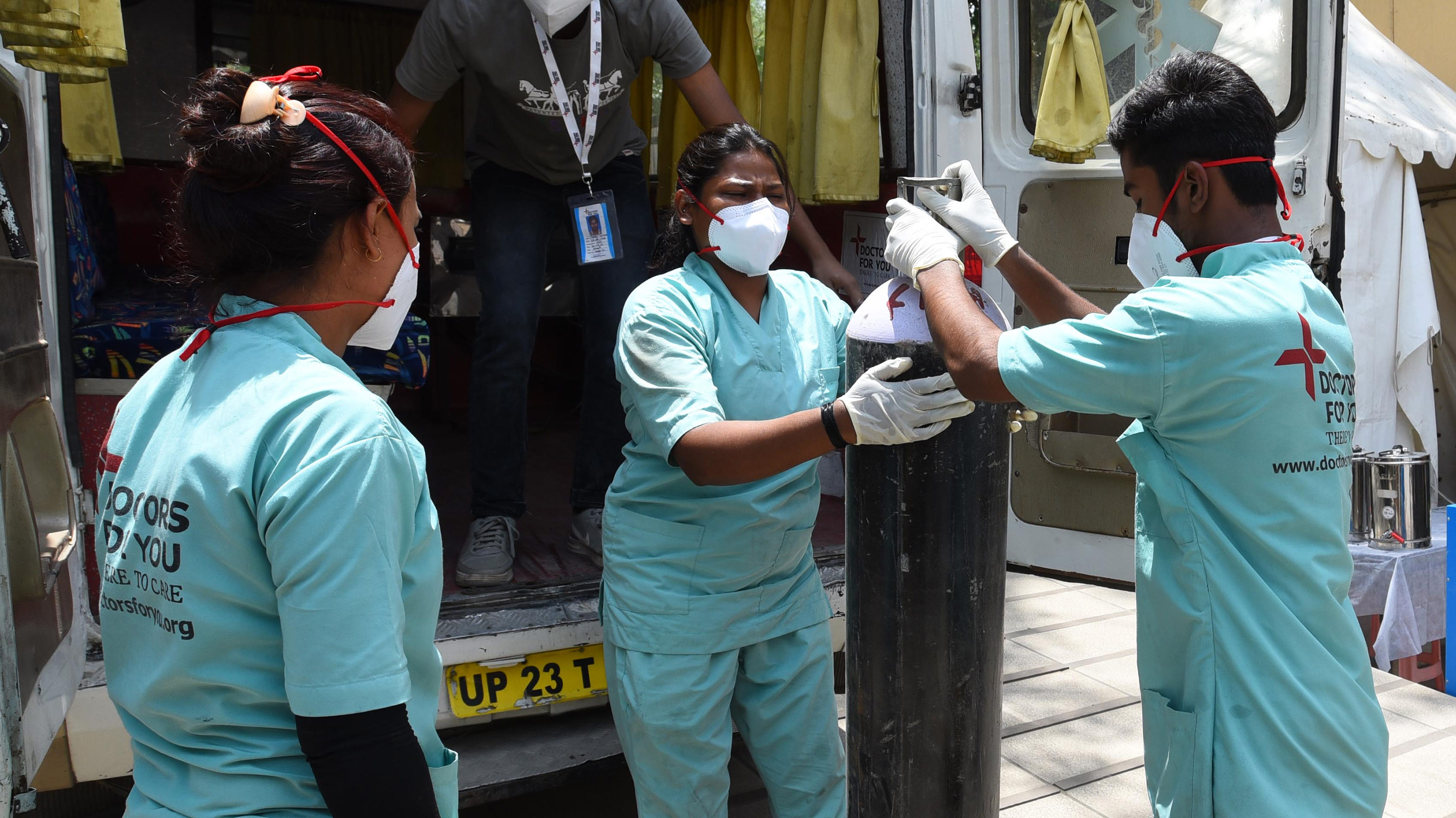 Health workers unloaded oxygen cylinders from a van at a Covid-19 care center in New Delhi, India, on May 16. 