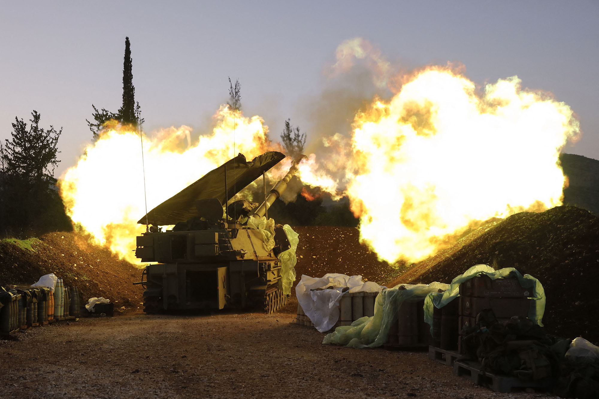 An Israeli artillery unit fires from a position in Upper Galilee in northern Israel towards southern Lebanon, on December 11.
