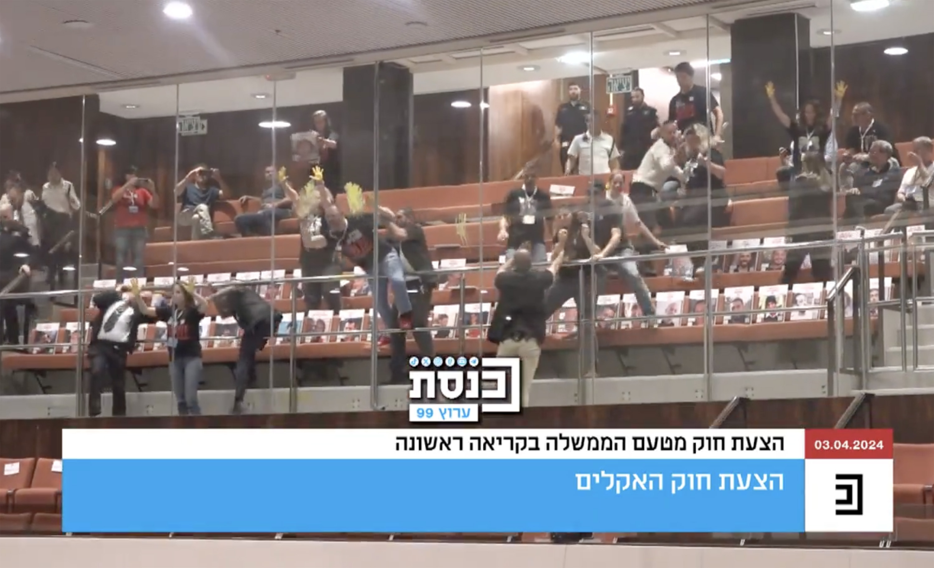 A screengrab taken from video posted to X shows family members of hostages held in Gaza stepping over seats in the Knesset, Israel's parliament, on Wednesday, April 3.
