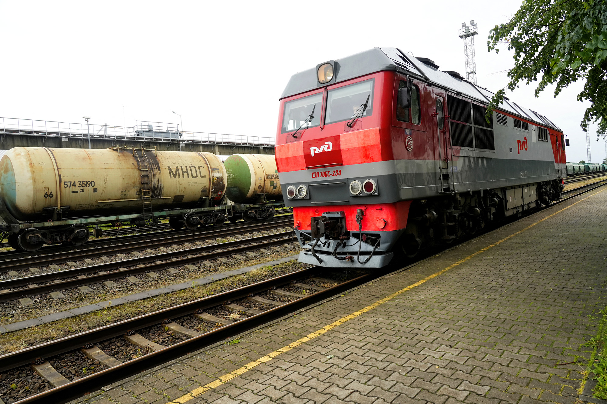 A Russian railway locomotive moves past freight train wagons at the border railway station in Kybartai, Lithuania, on June 21.