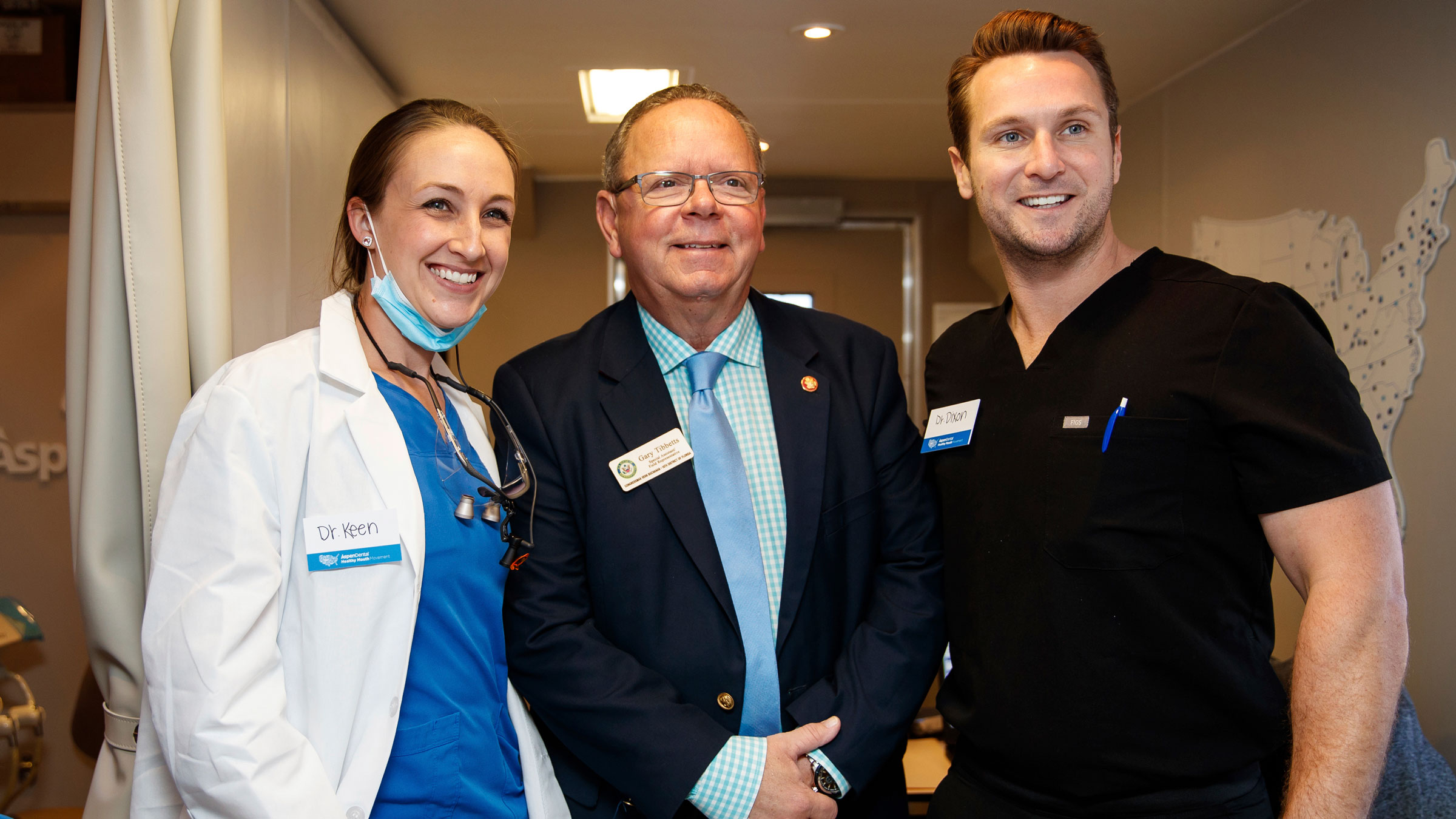 Gary Tibbetts, center, visits a mobile dental office in Bradenton, Florida, in March 2019.
