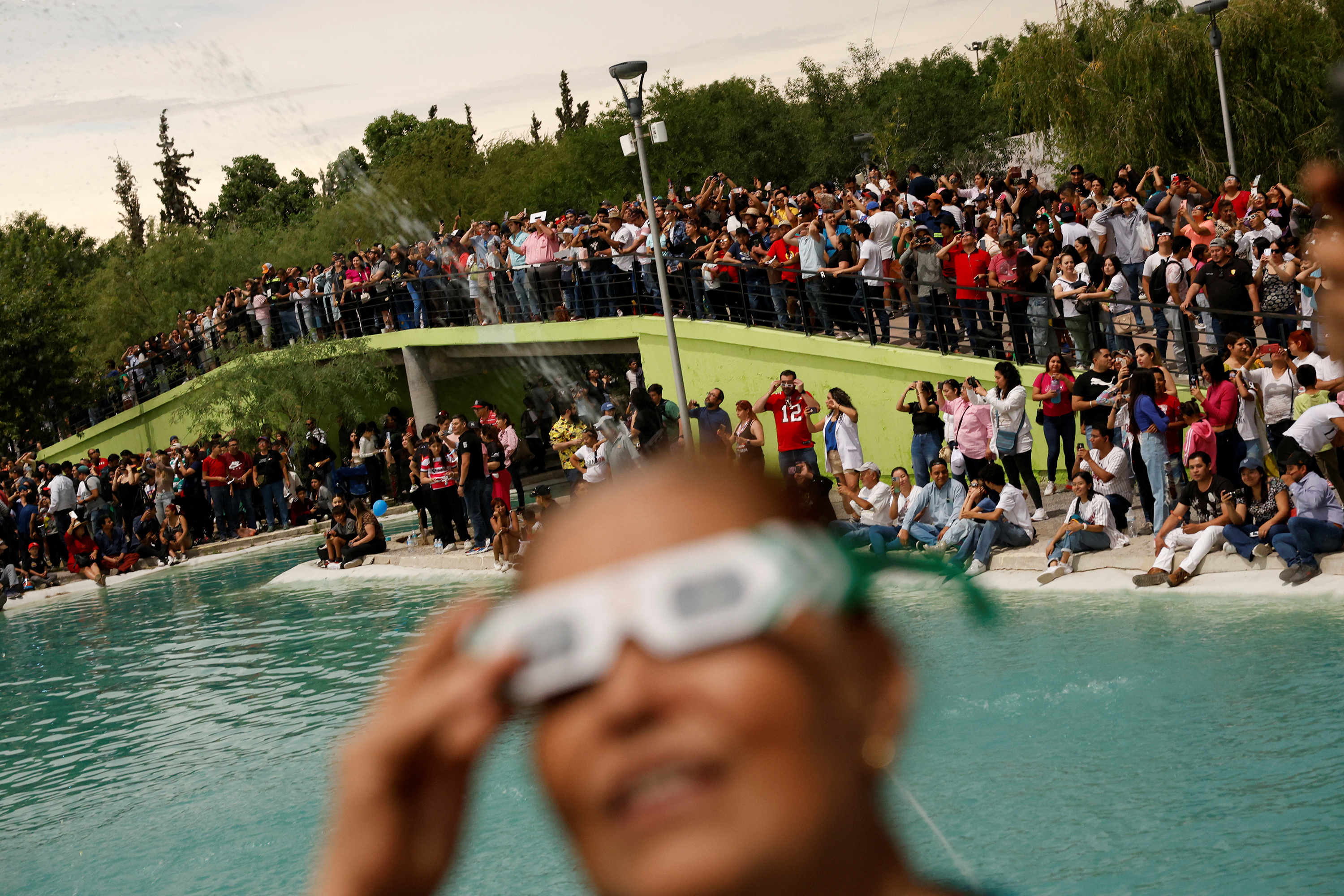 People observe the eclipse in Torreón, Mexico.