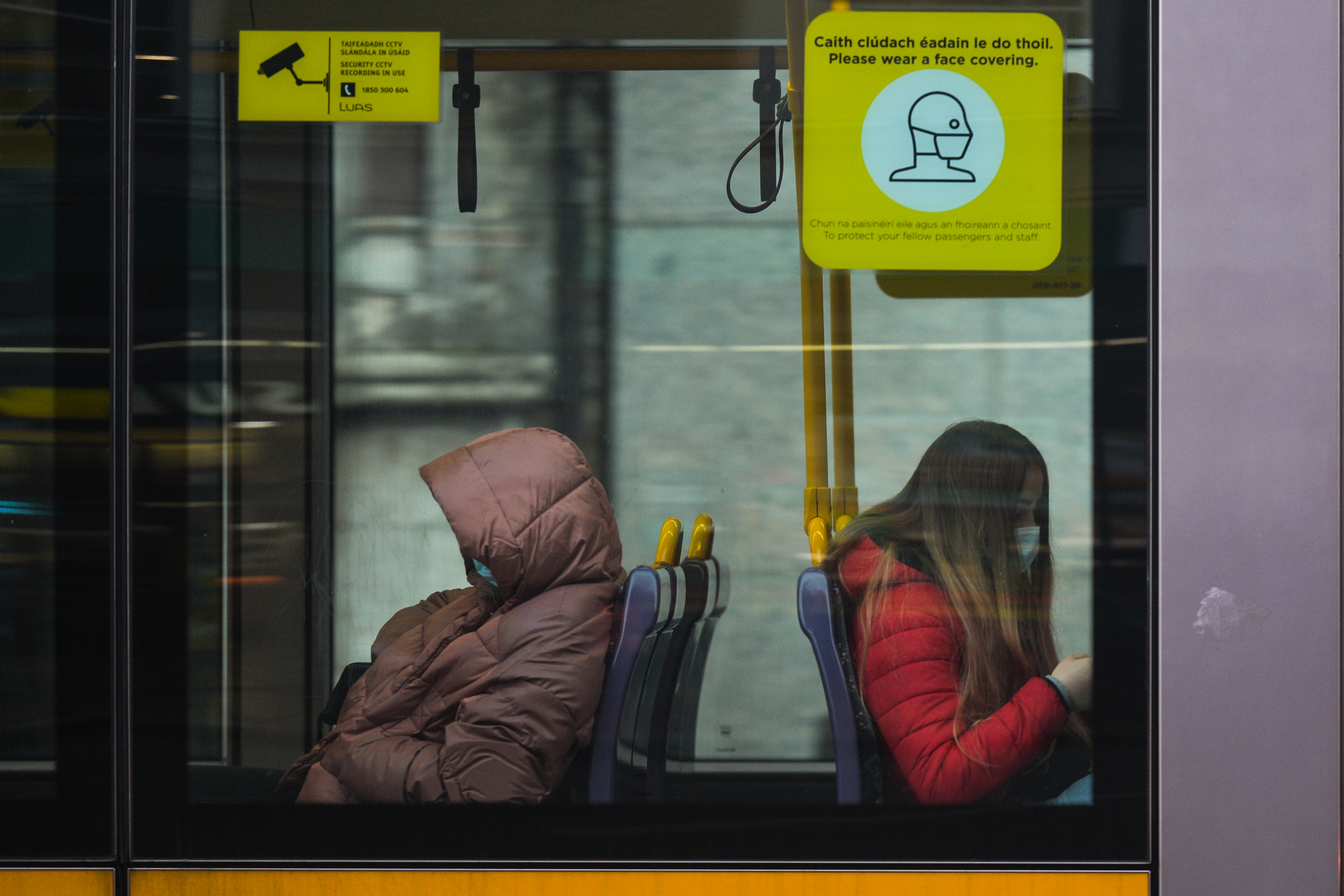 People wearing face masks are seen inside a tram in Dublin, Ireland on January 6.