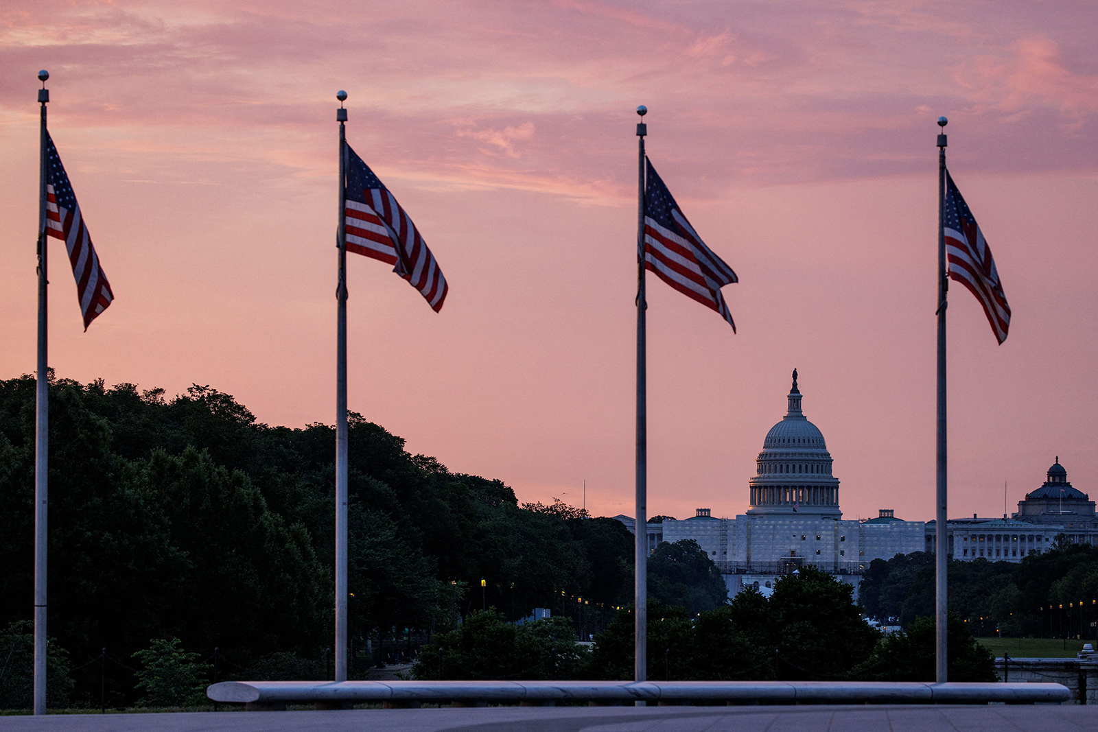 The US Capitol building is seen from the base of the Washington Monument as the sun rises in Washington, DC, on May 28.