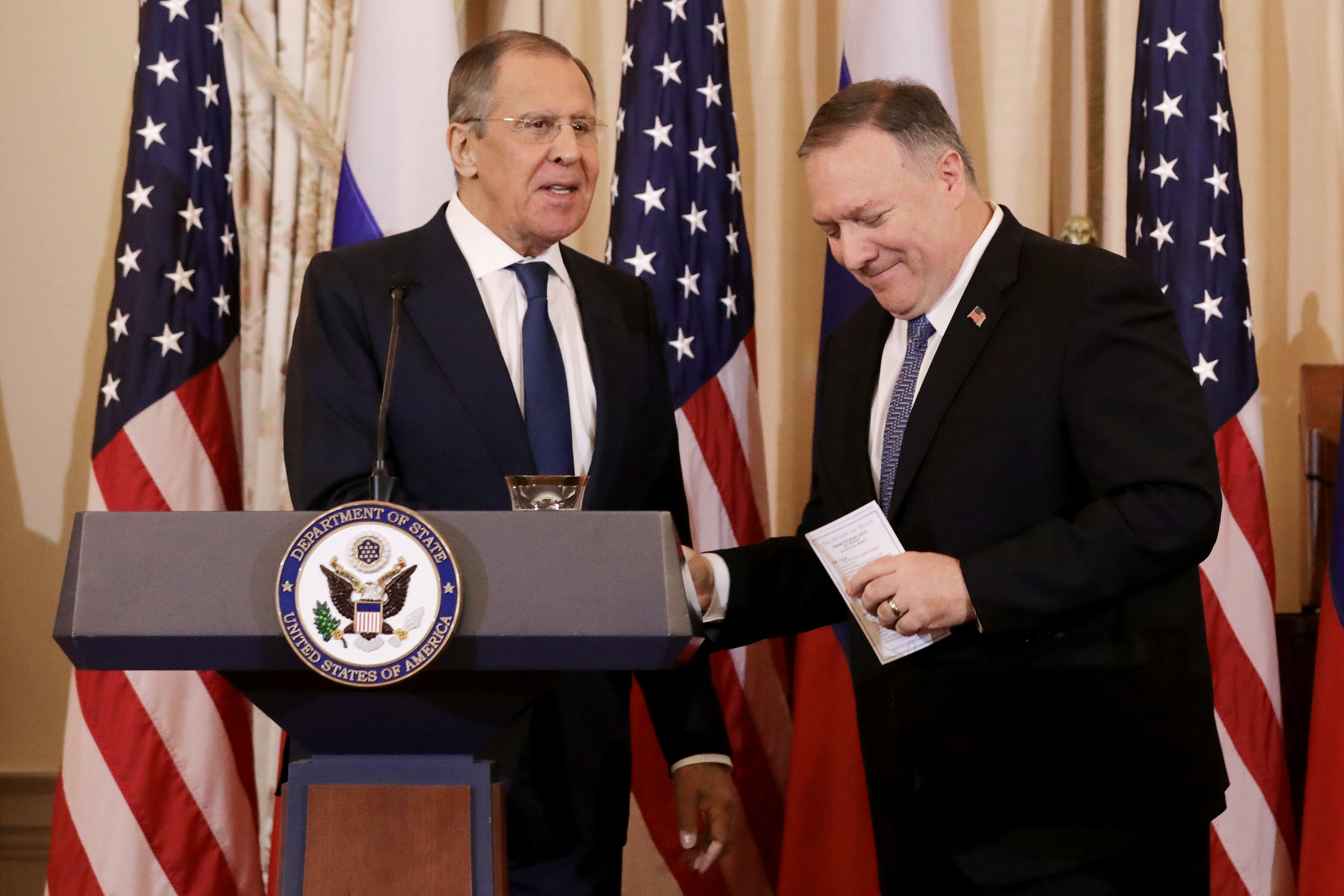 Russian Foreign Minister Sergey Lavrov and US Secretary of State Mike Pompeo shake hands at the conclusion of a joint news conference in the Franklin Room at the State Department in December 2019.