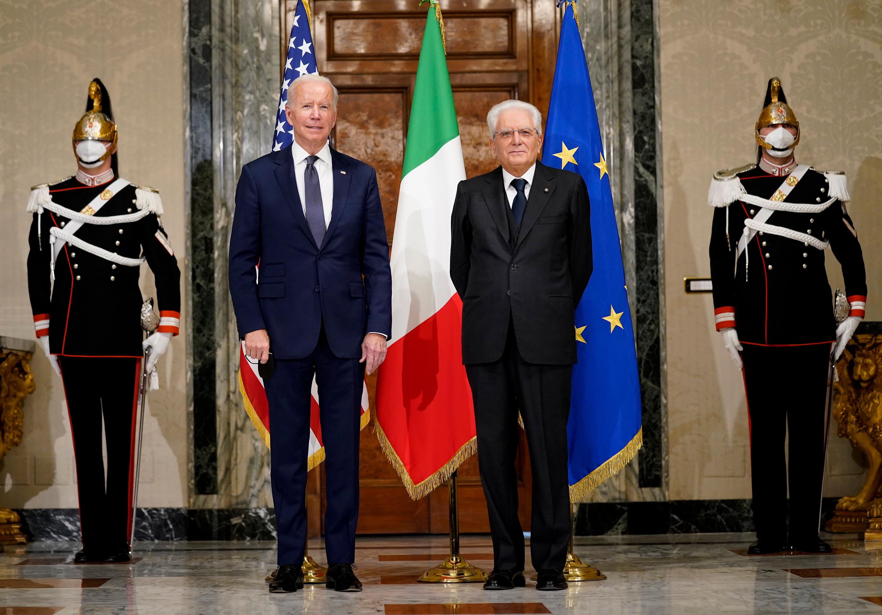 Biden, left, poses with Italy's President Sergio Mattarella during a formal greeting at the Quirinale Palace in Rome, on Friday.