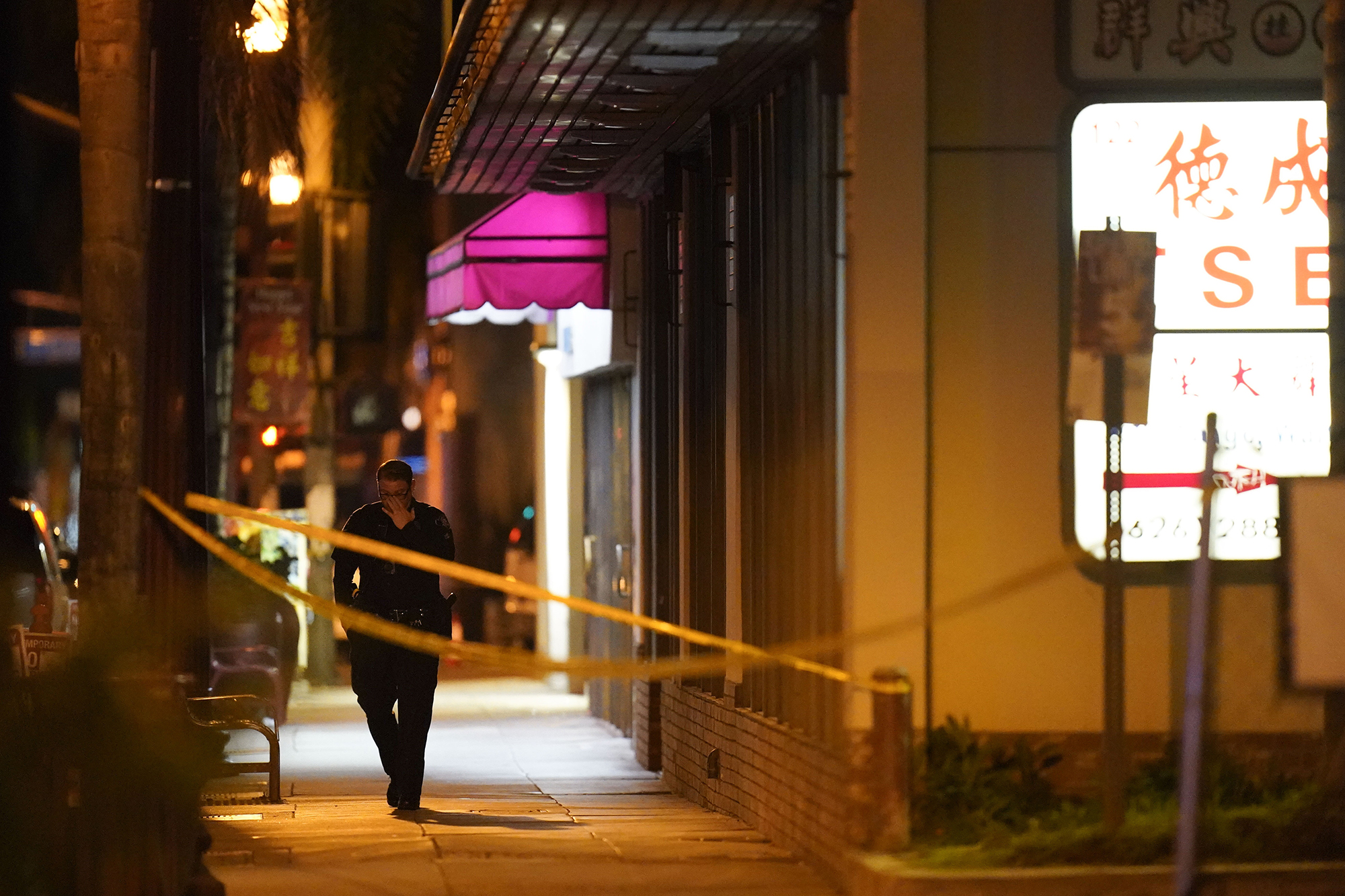 A police officer walks near the scene of the shooting.