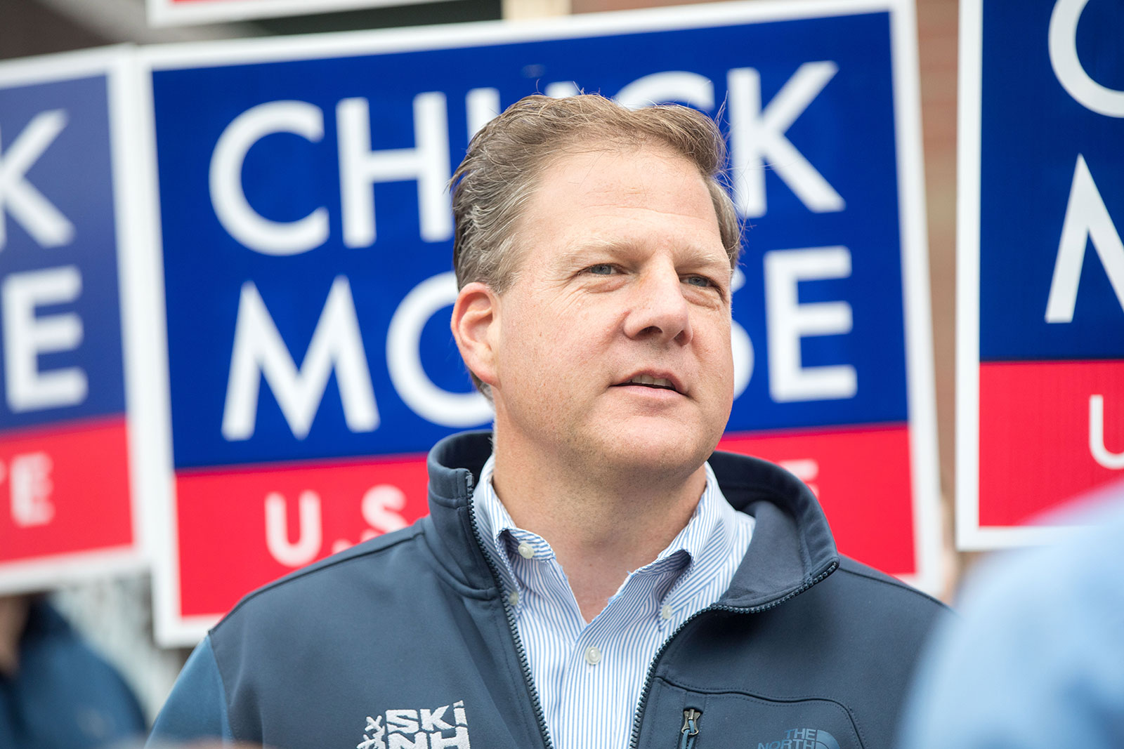 New Hampshire Gov. Chris Sununu speaks with people at a campaign stop for Republican Senate candidate Chuck Morse in Bedford, New Hampshire on Tuesday. 