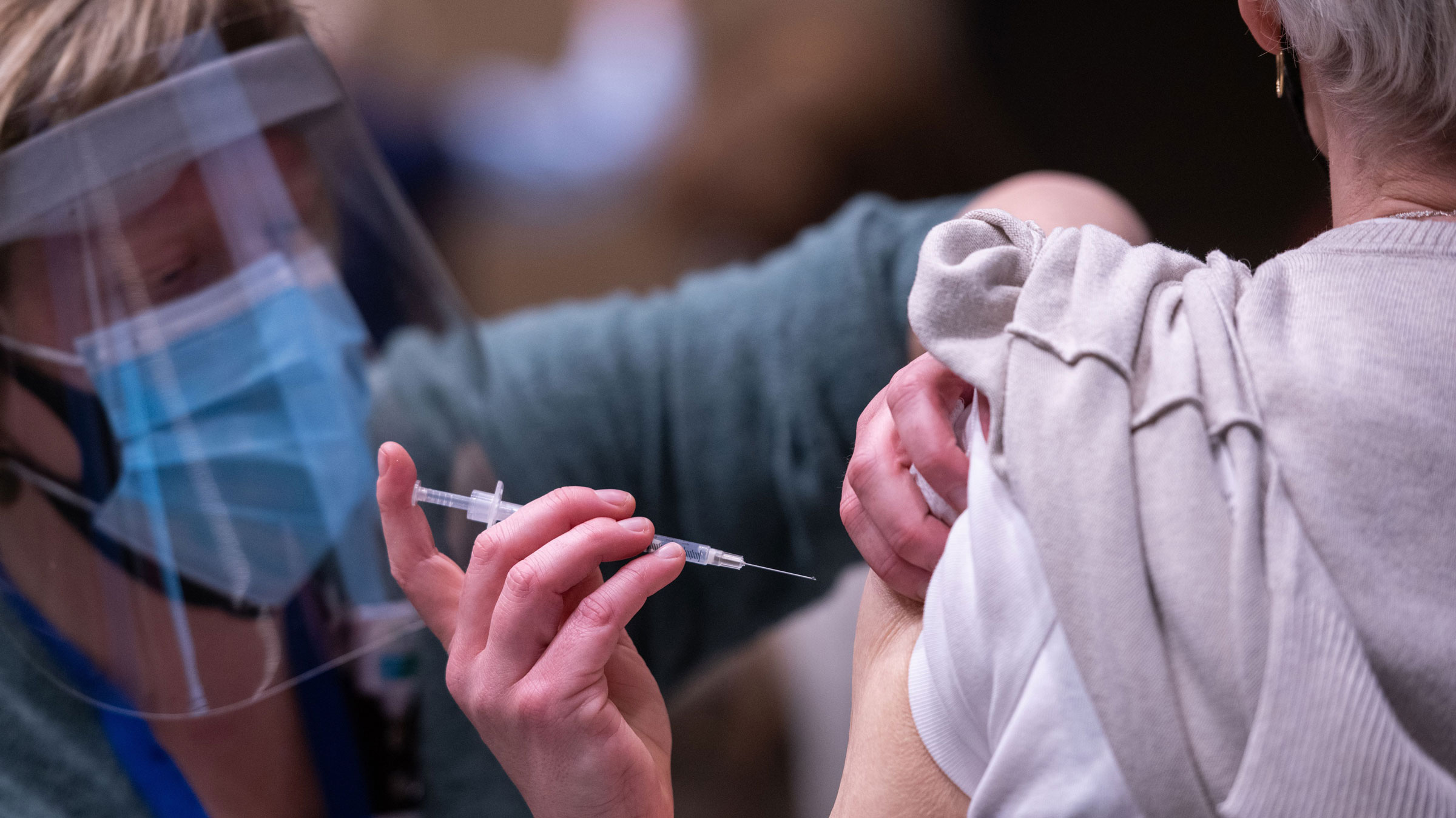 Advanced registered nurse practitioner Erin Forsythe administers a Covid-19 vaccine at a pop-up clinic in Seattle on Sunday.