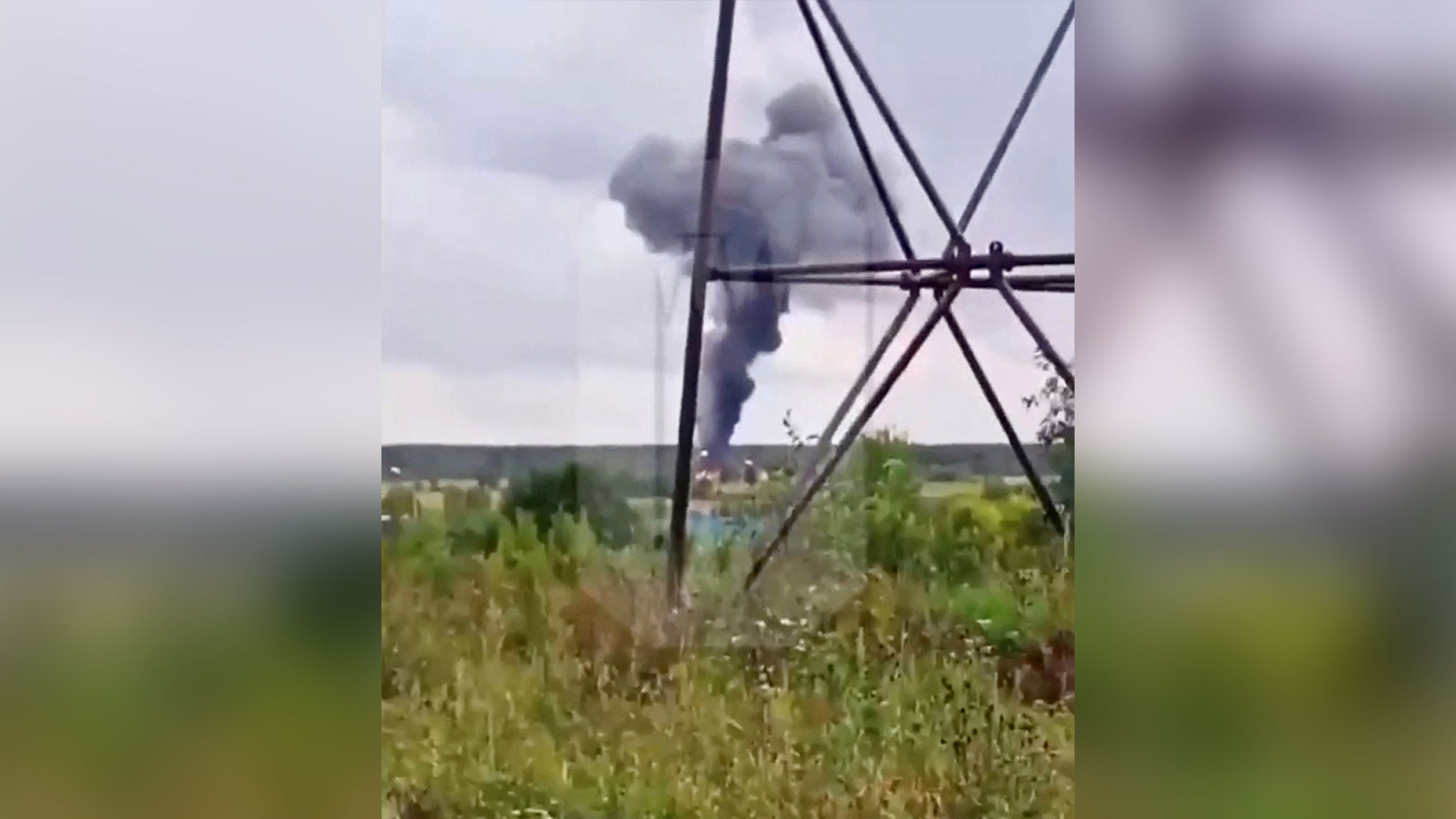 A view shows smoke rising above a plane on fire in the Tver region, Russia, in this still image from video published on Wednesday.