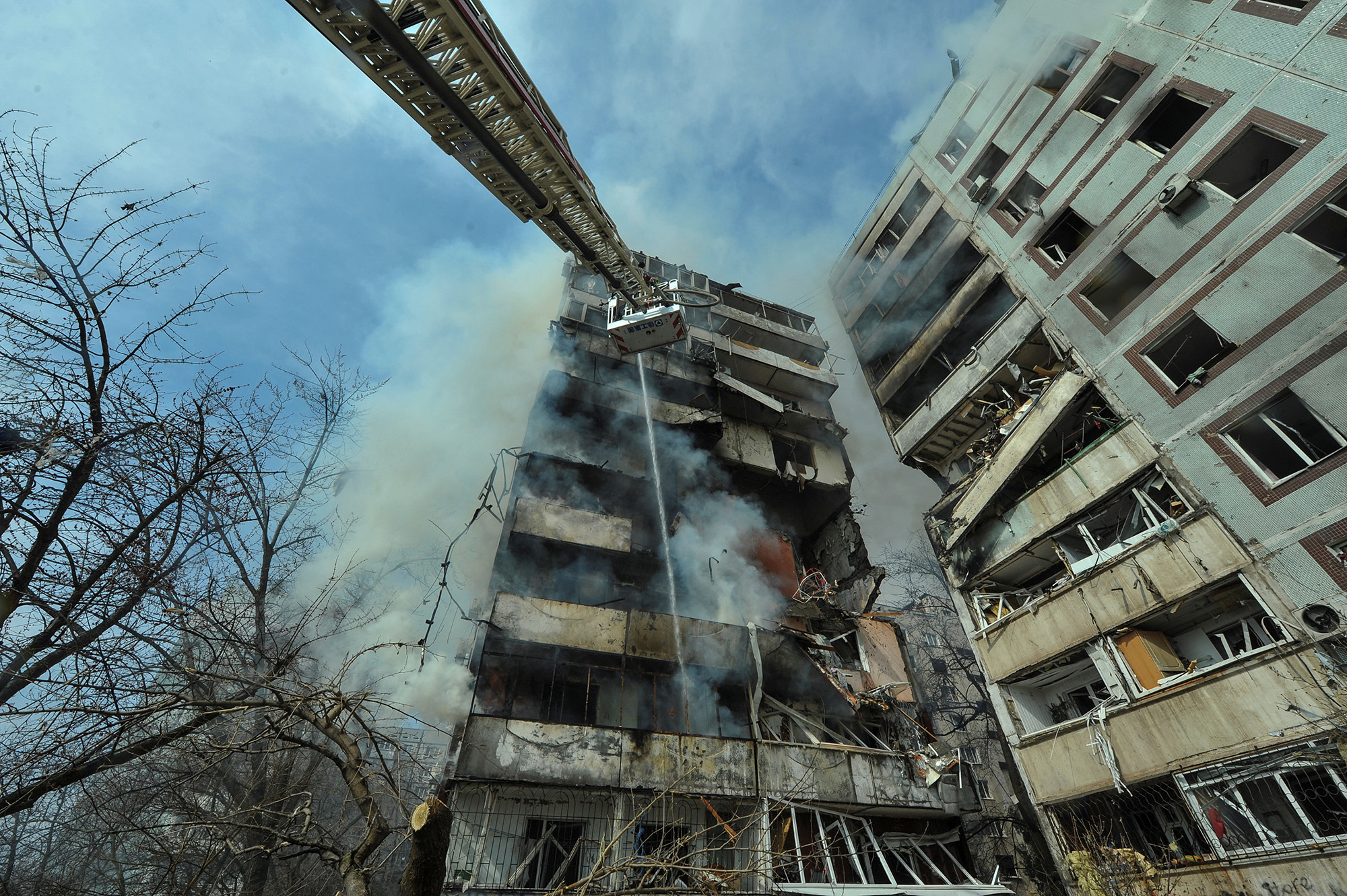 A ladder extends against a residential building damaged by a Russian missile strike in Zaporizhzhia, Ukraine, on March 22.