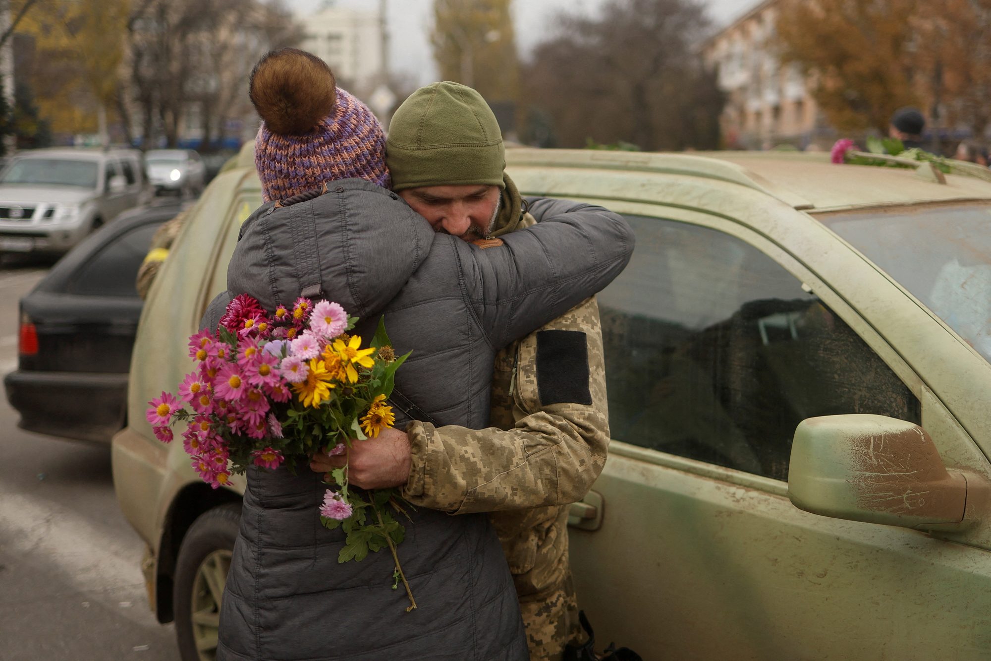 A resident hugs a Ukrainian serviceman after Russia's retreat from Kherson, in central Kherson, on Sunday.