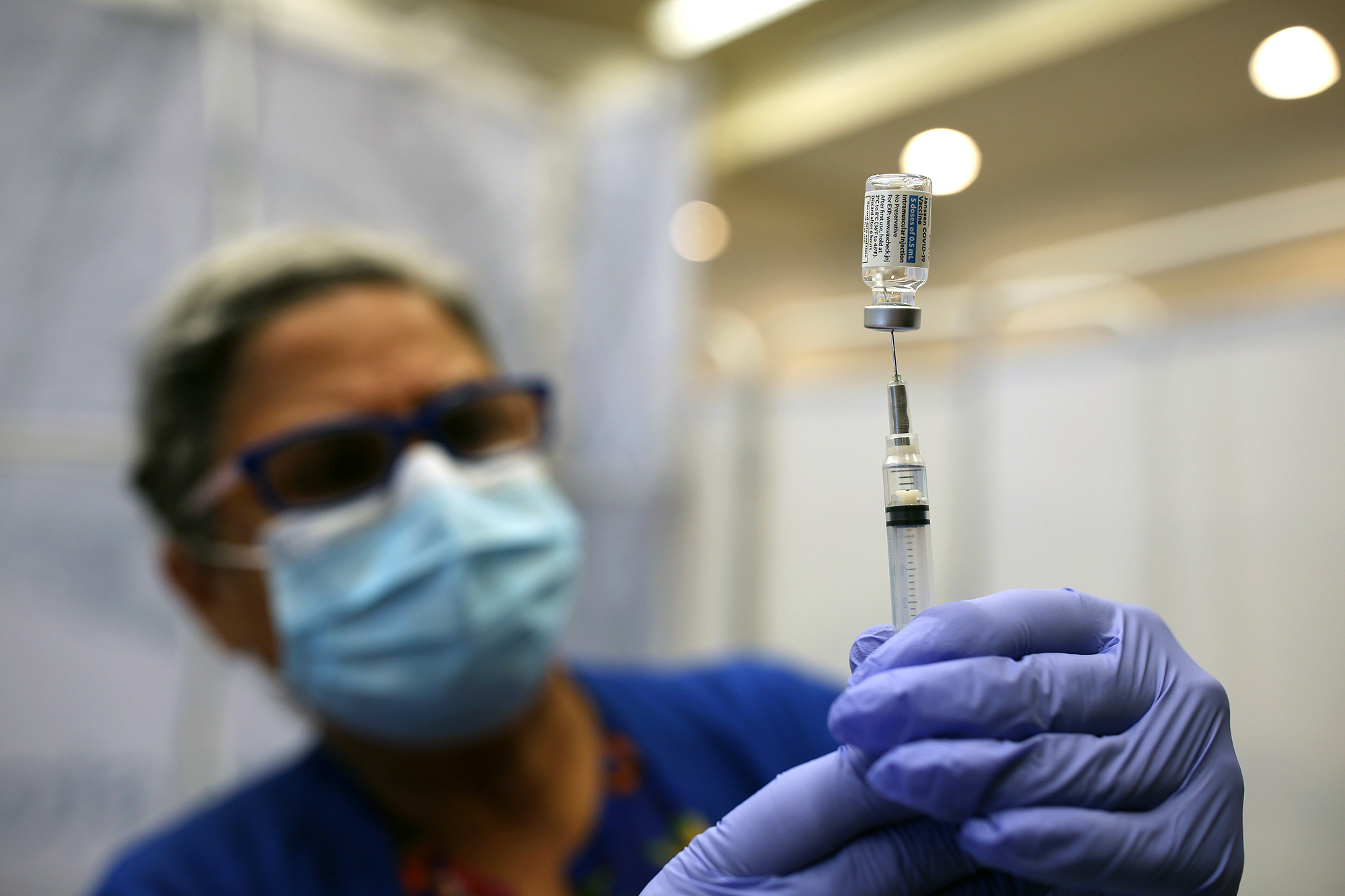 A health worker prepares a syringe of the Johnson & Johnson Covid-19 vaccine at a clinic in Portland, Maine, on July 15. 