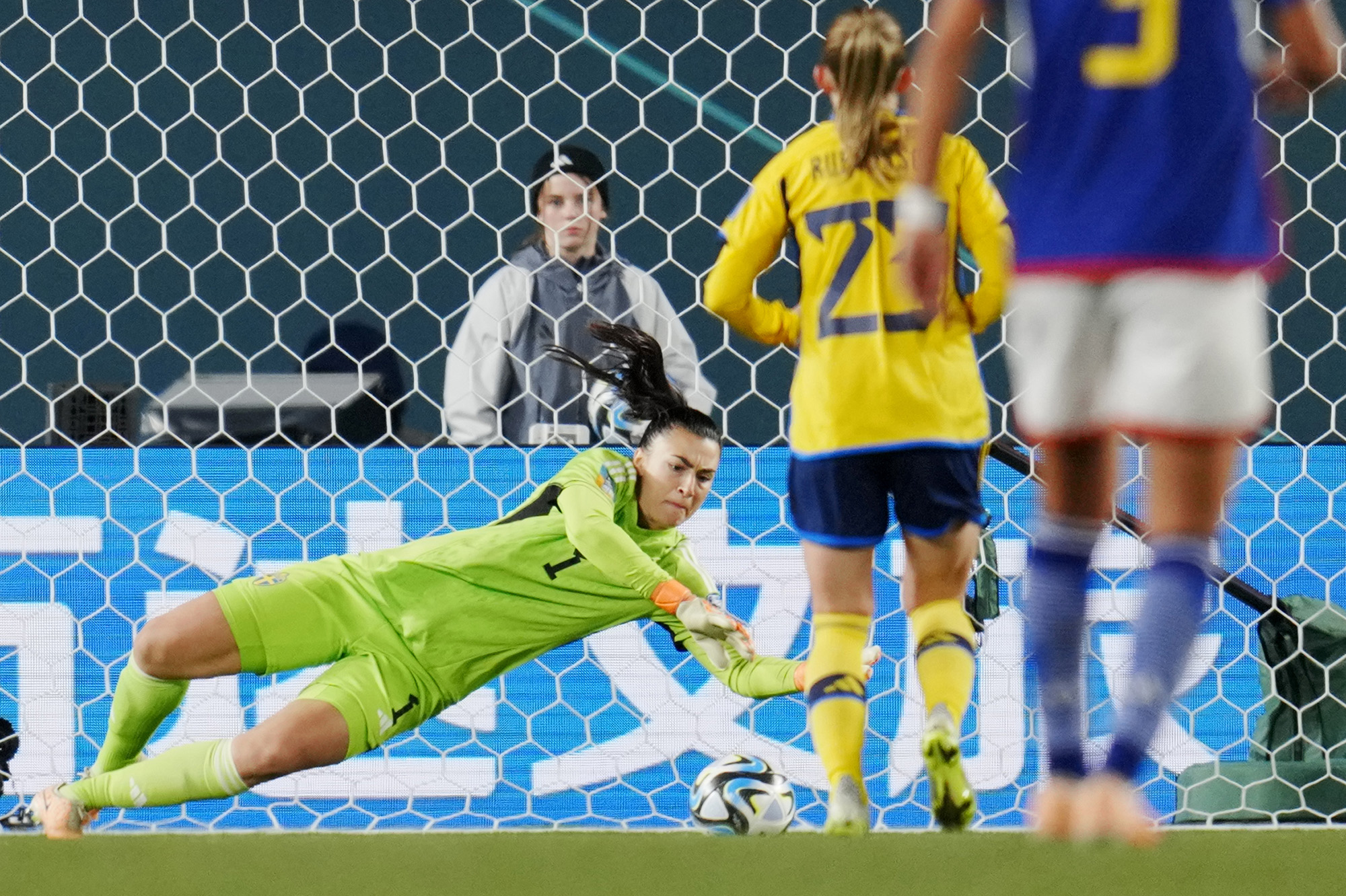 Sweden goalkeeper Zećira Mušović dives for a save during the Women's World Cup quarterfinal match against Japan at Eden Park in Auckland, New Zealand.