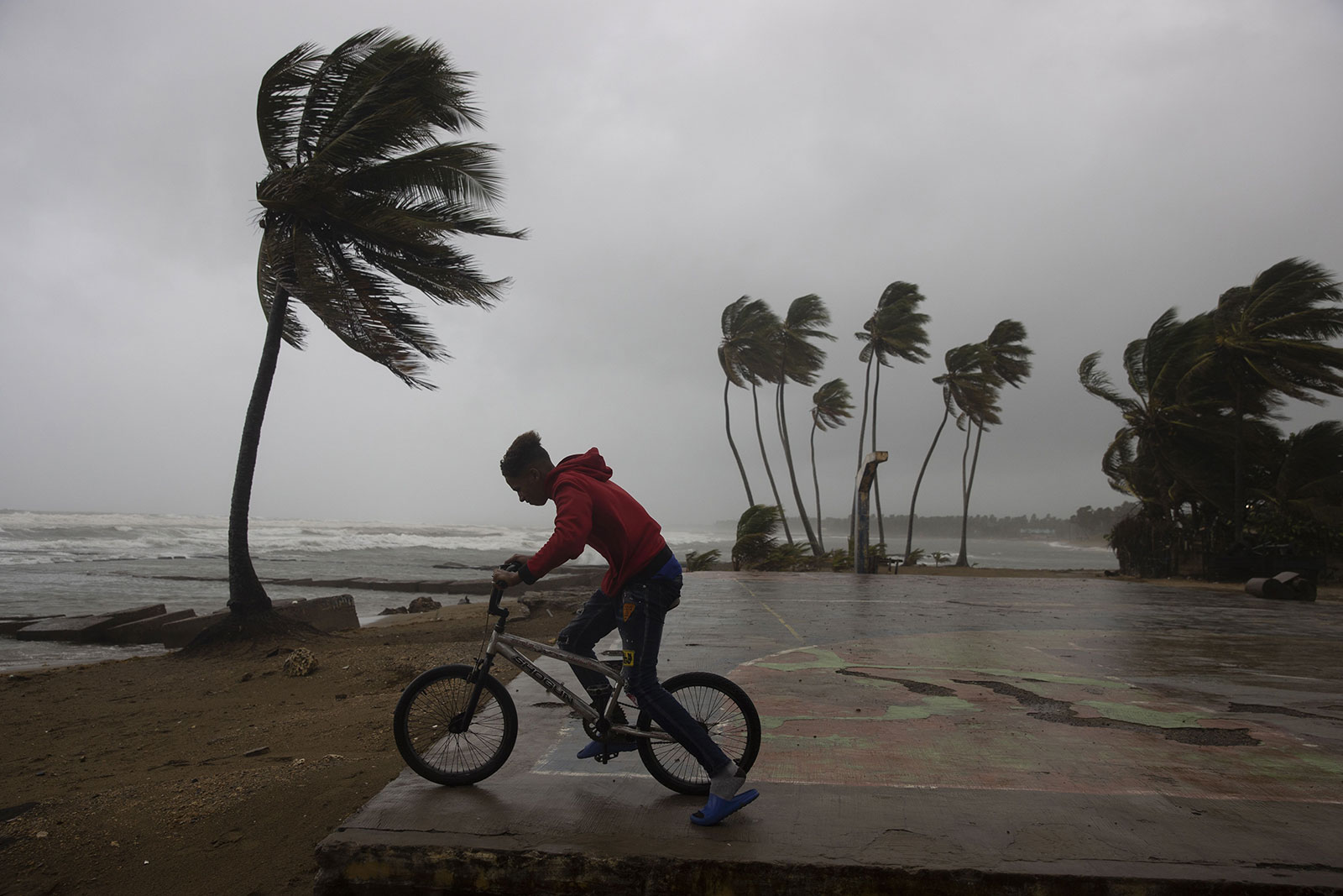 A cyclist observes the strong waves in Nagua, Dominican Republic on September 19. 