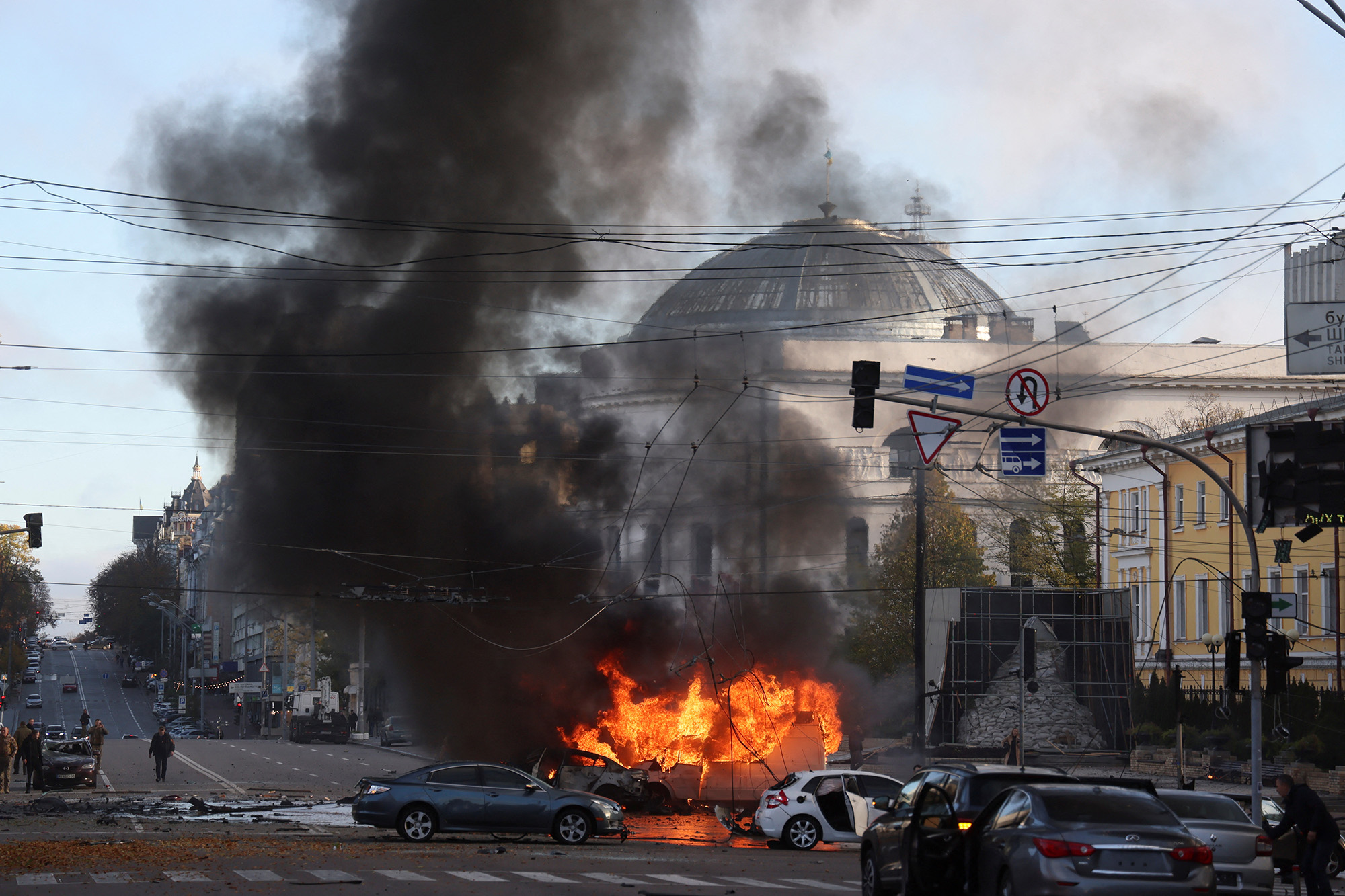 Cars burn after Russian military strike in central Kyiv, Ukraine, on October 10.
