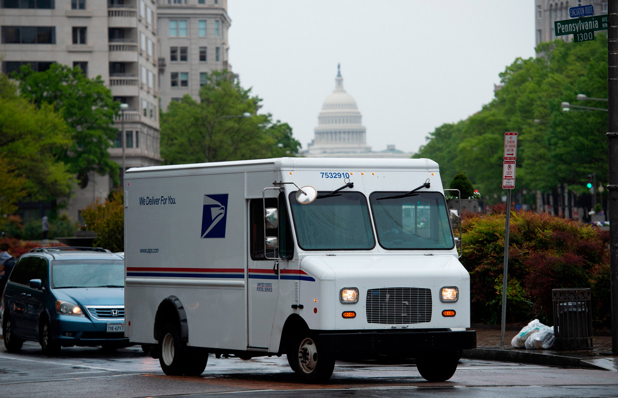 A US Postal Service truck drives down Pennsylvania Avenue in Washington, DC, on April 23.