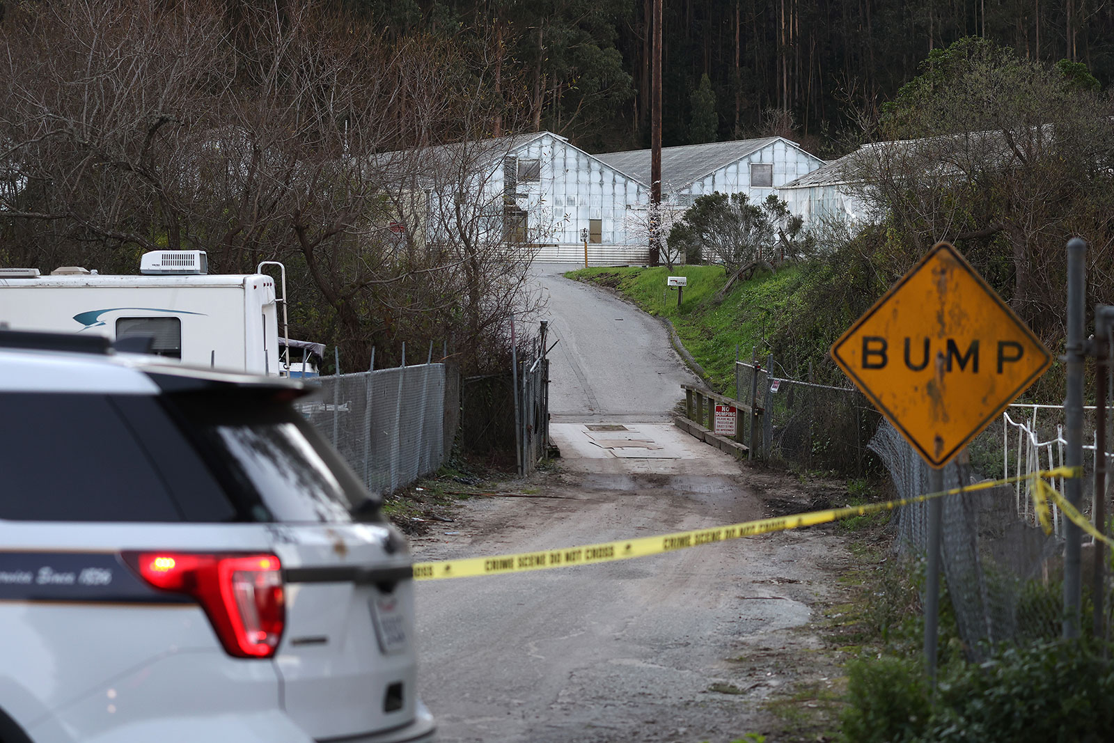 A San Mateo County sheriff deputy blocks the entrance to a farm on January 24 in Half Moon Bay, California. 