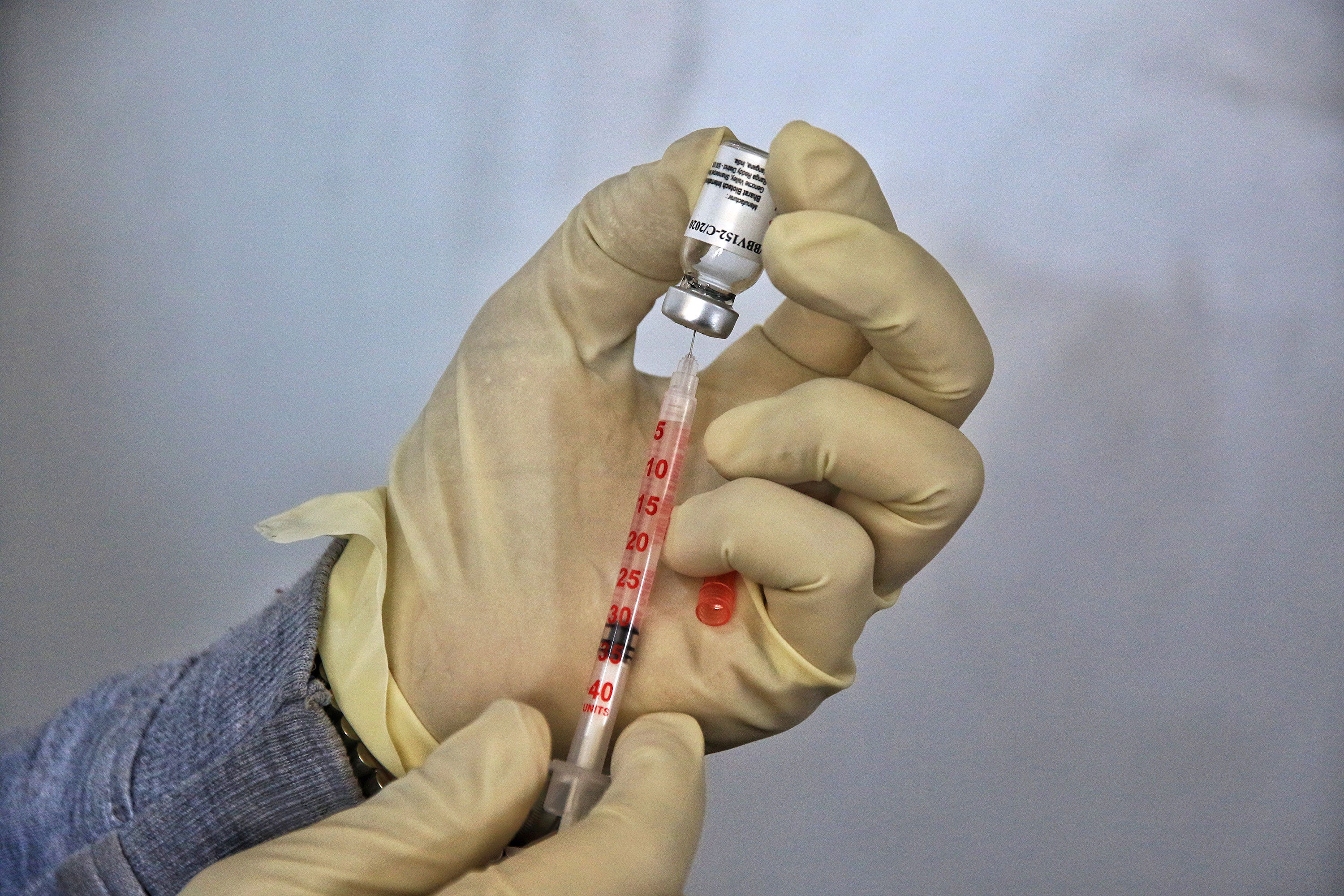 A health worker fills a syringe with the Covaxin Covid-19 vaccine at Maharaja Agrasen Super Speciality Hospital in Jaipur, India, on December 18.