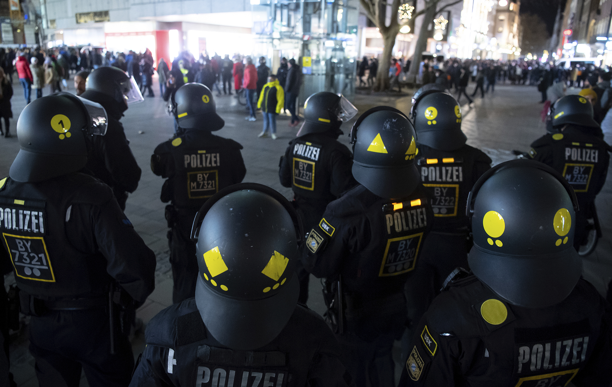 Police officers stand on the Marienplatz in Munich, Germany on Wednesday. Bavarian police are preparing for unannounced "walks" and gatherings of opponents of the state's pandemic measures in numerous municipalities. 