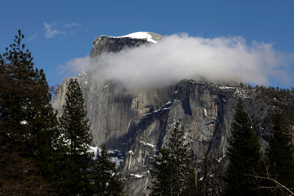 Yosemite Half Dome dusted with snow and clouds on April 11.