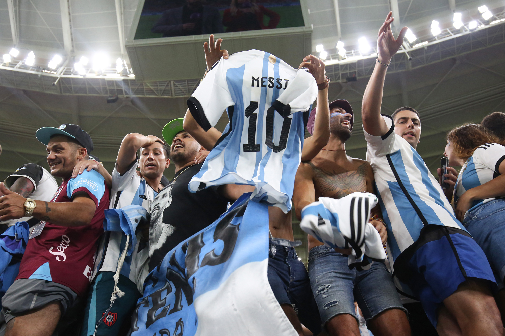 Argentine fans wearing Lionel Messi jerseys during their match against Australia at the Ahmed Ben Ali Stadium in Qatar on Saturday.