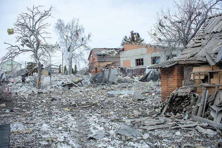 Debris is seen next to houses destroyed by shelling, amid Russia's invasion of Ukraine, in Sumy, Ukraine March 8, in this picture obtained from social media.