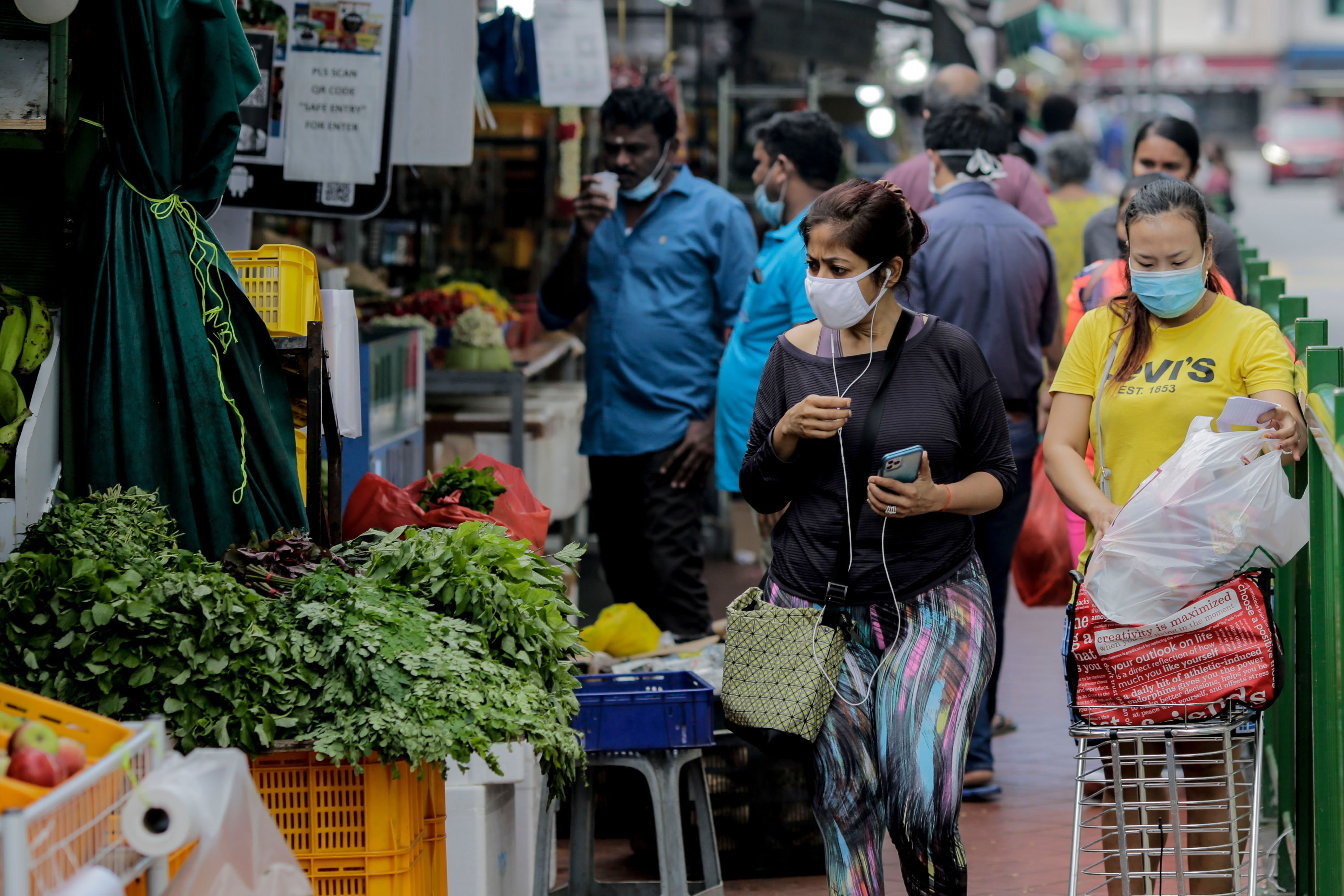 People visit the Little India district in Singapore on July 21.