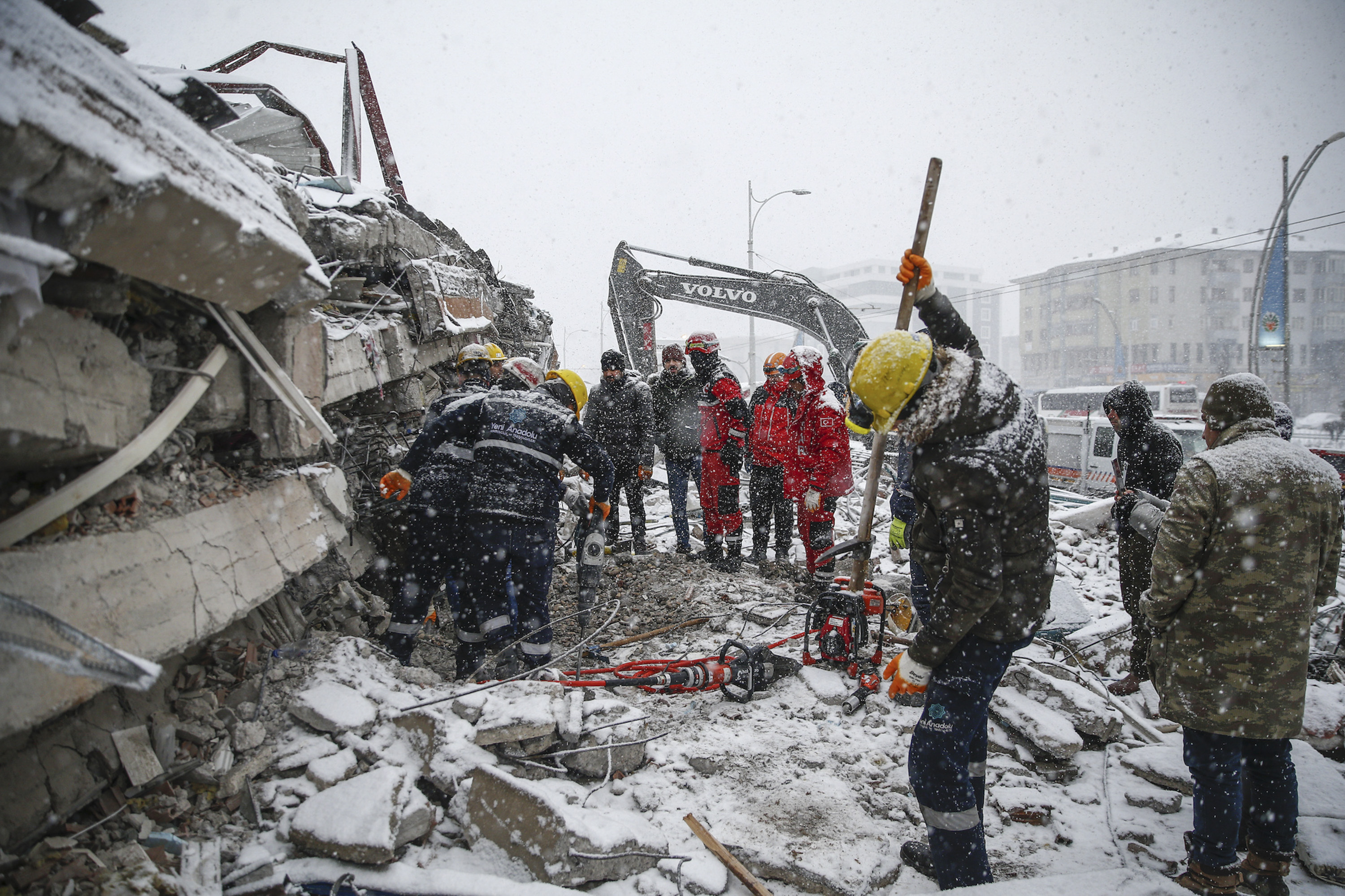 Search and rescue efforts continue through cold weather conditions in Malatya, Turkey, on Tuesday. 