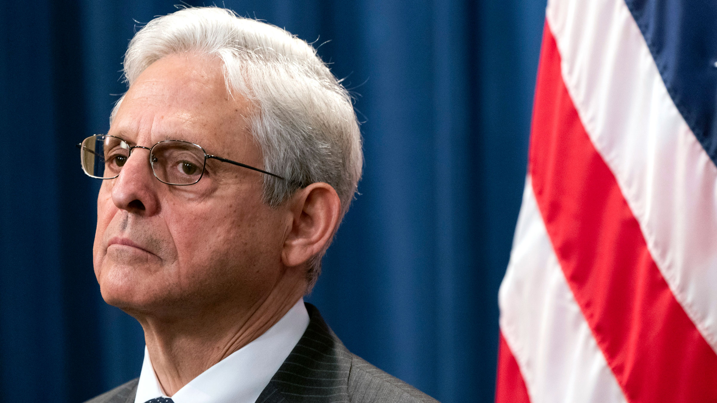 Attorney General Merrick Garland attends a news conference at the Department of Justice on Monday.