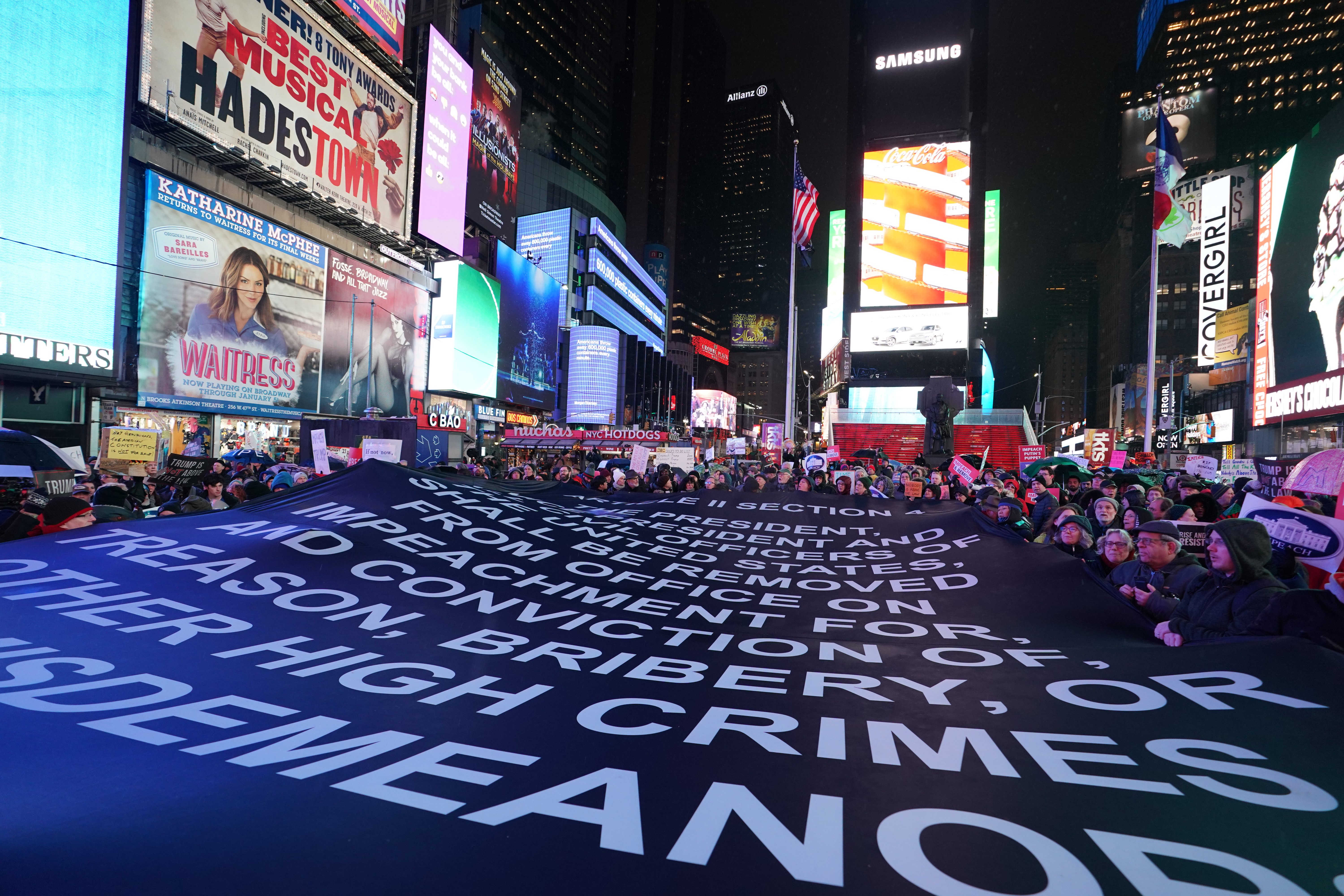 Protesters gather in Times Square on Tuesday.