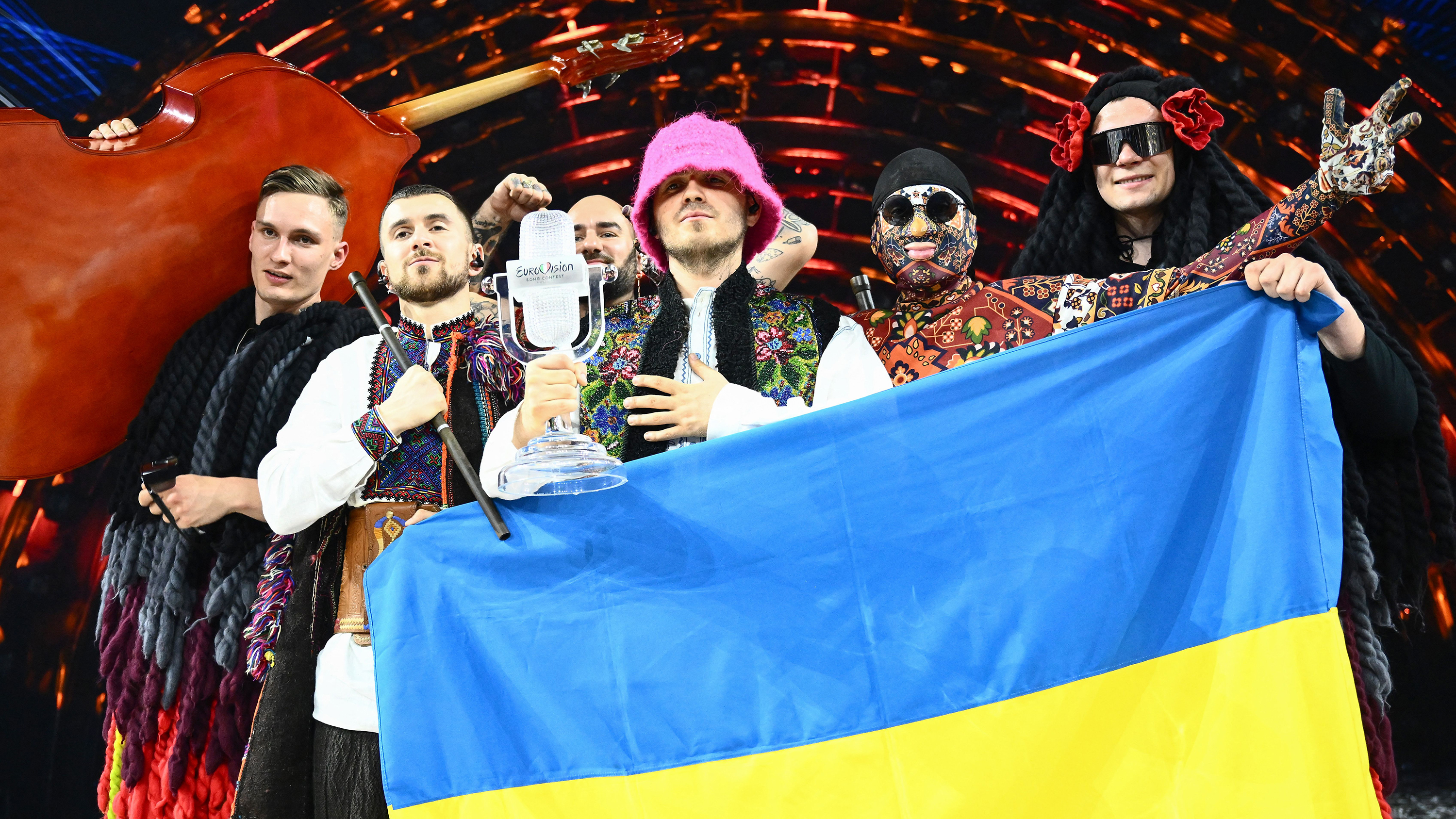 Members of the band Kalush Orchestra pose onstage with their trophy after winning Eurovision on May 14. 