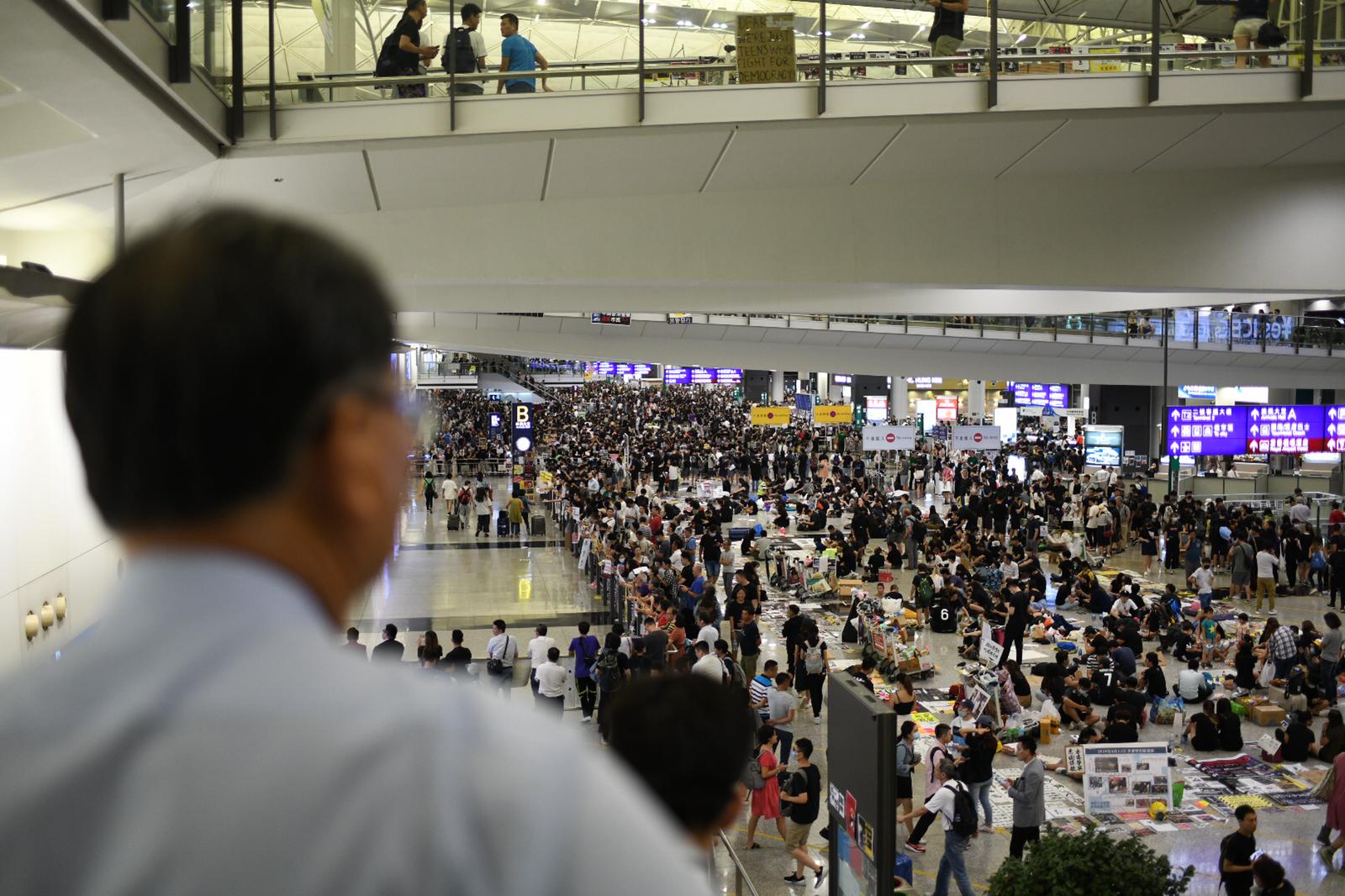 Hundreds of protesters occupy Hong Kong's international airport for the second day in a row.