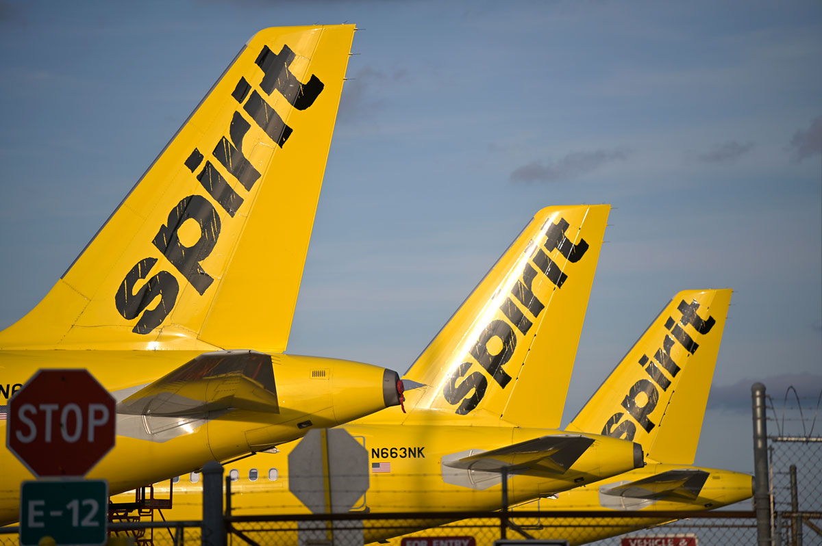 Spirit Airlines passenger jets are parked outside a hangar at Orlando International Airport on April 18, 2020, in Orlando, Florida.