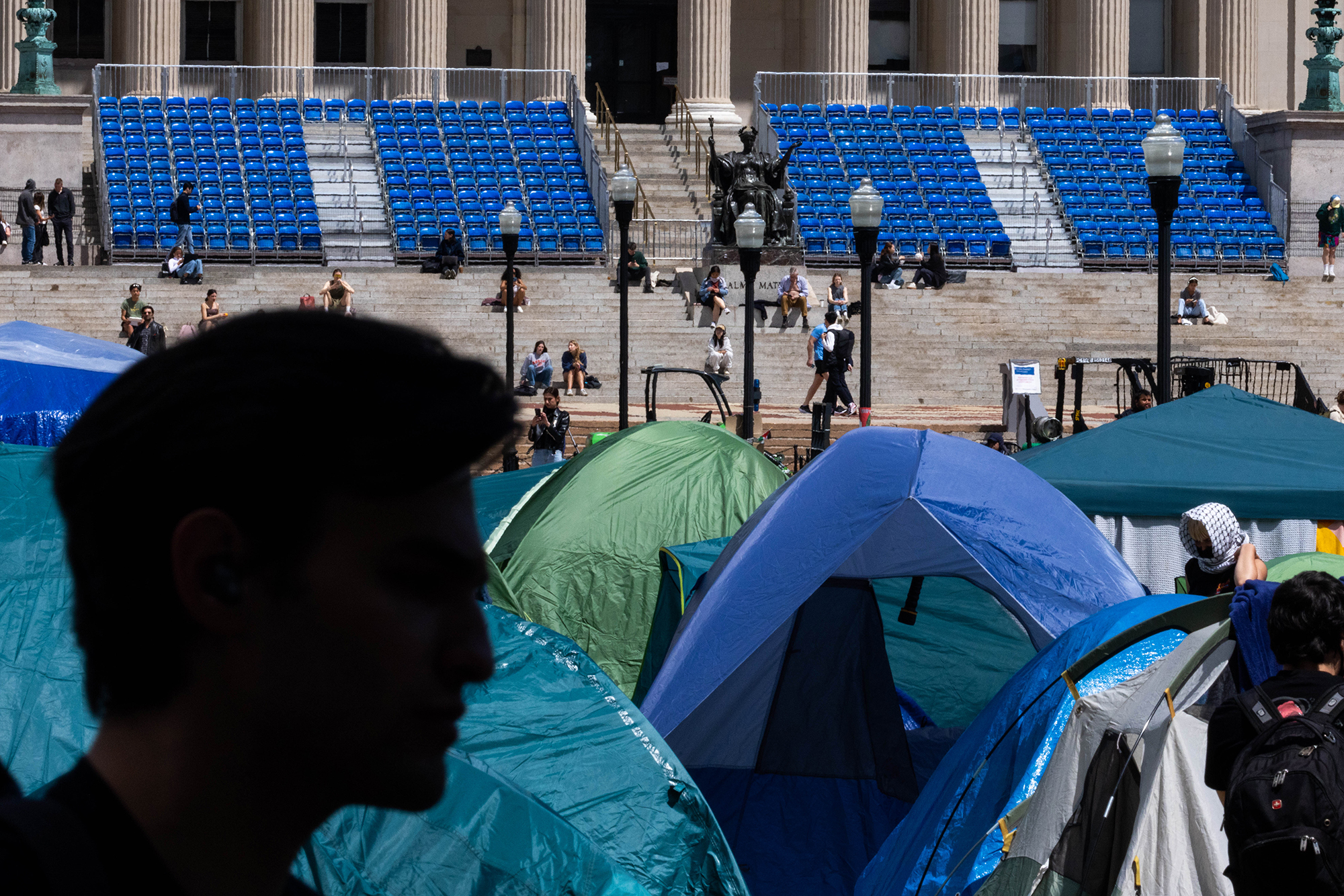 Tents set up by demonstrators are seen today on the Columbia campus against the backdrop of the university's preparation for graduation ceremonies.