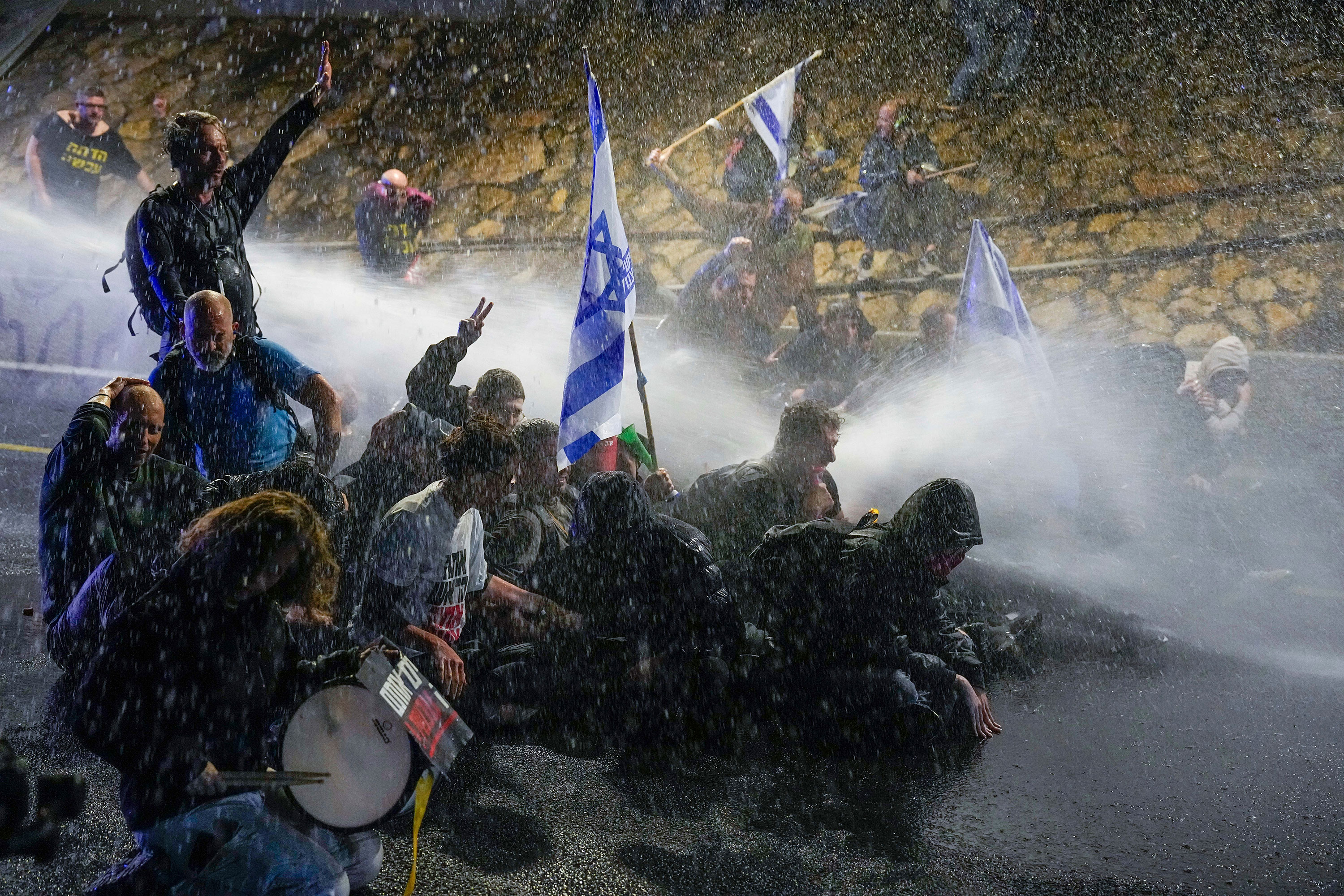 Police use water cannon to disperse protesters in Tel Aviv on March 9. 