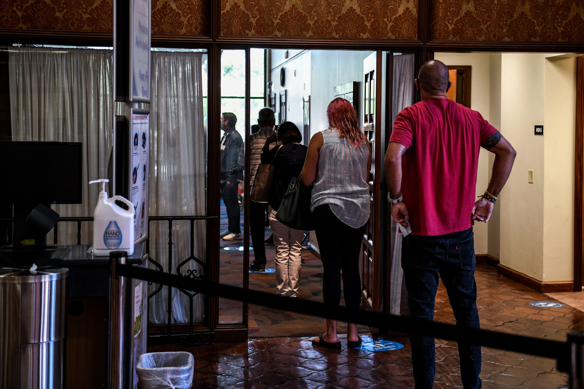 Voters wait in line to cast their early ballots at the The Coral Gables Branch Library in Miami, Florida on October 27.