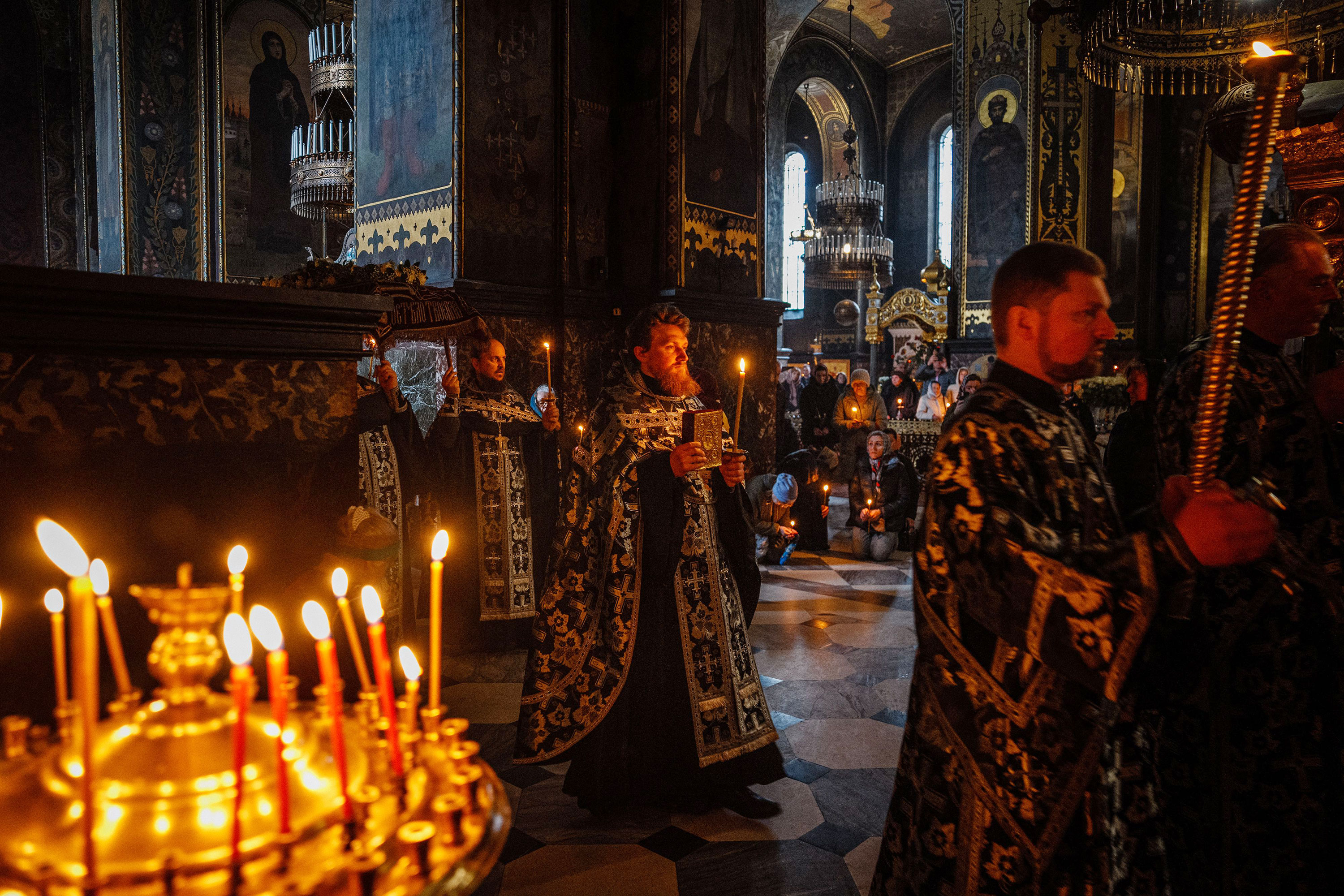 Ukrainian Orthodox priests attend Good Friday service at Saint Volodymyr's Cathedral in Kyiv on April 14. 
